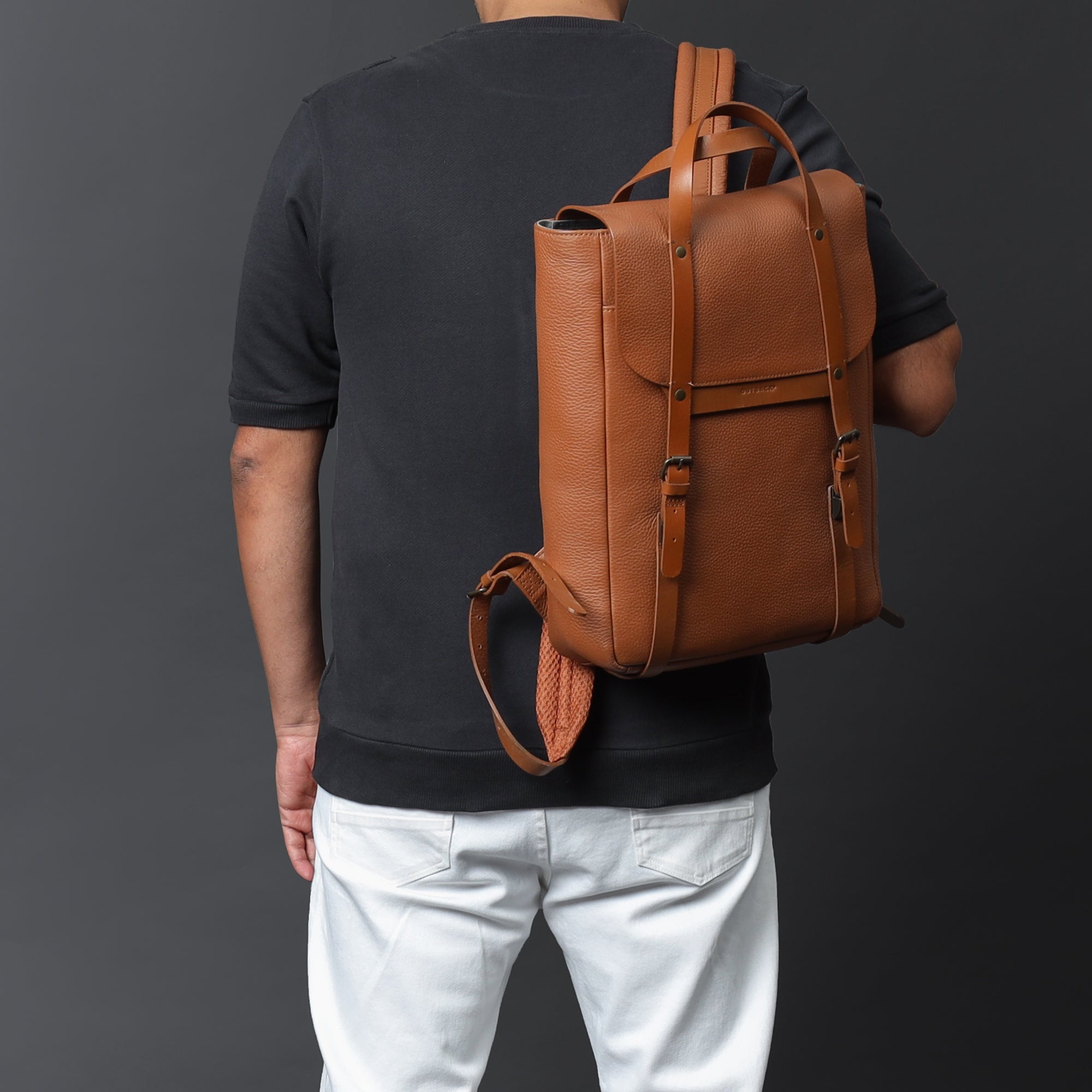 Oslo Leather Backpack made from premium full grain leather, featuring multiple pockets, adjustable straps, and a sleek design.