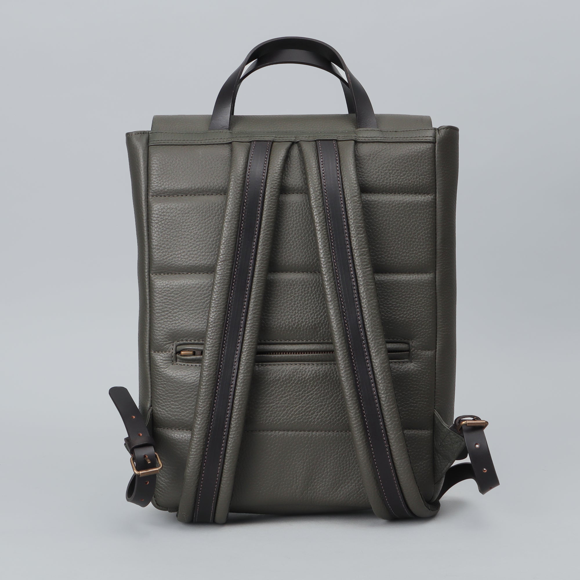 Oslo Leather Backpack made from premium full grain leather, featuring multiple pockets and adjustable straps, ideal for laptops and daily use.