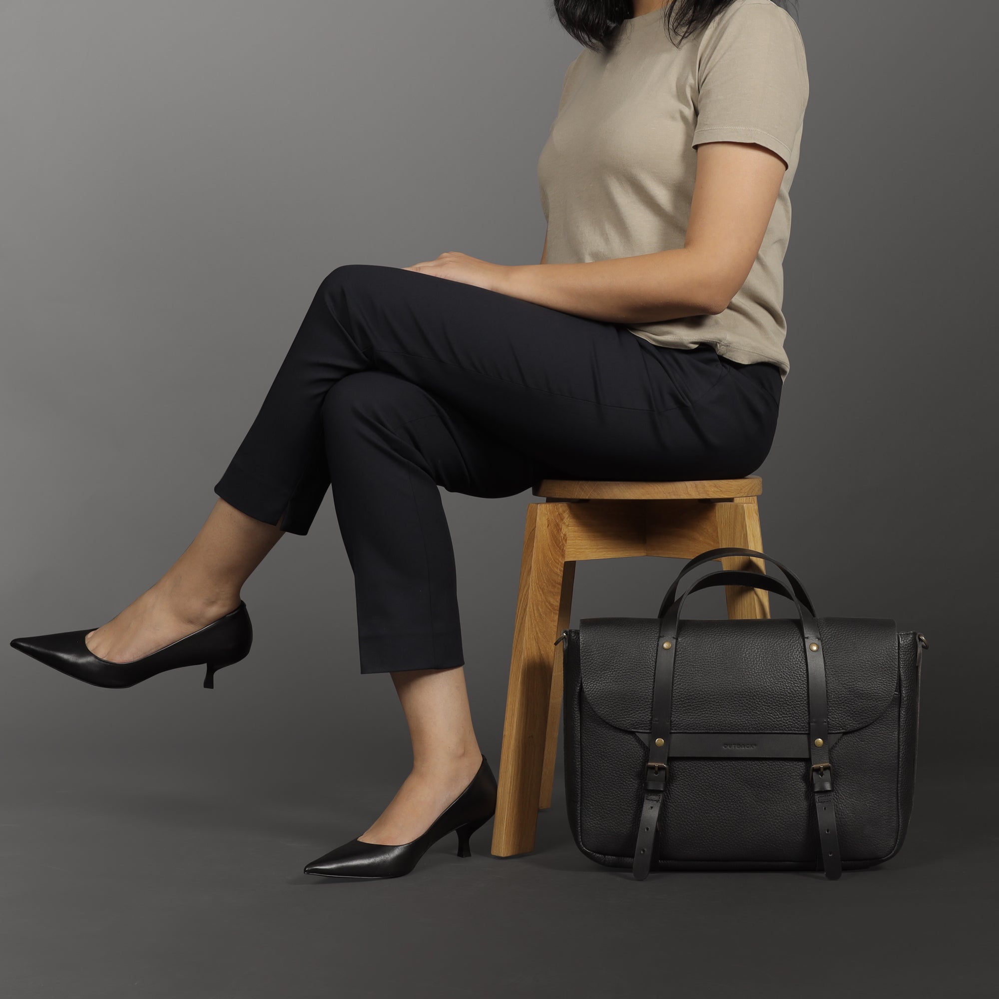 Oslo Leather Briefcase showcasing premium full grain leather, zipper pocket, and magnetic slip pocket for easy access.