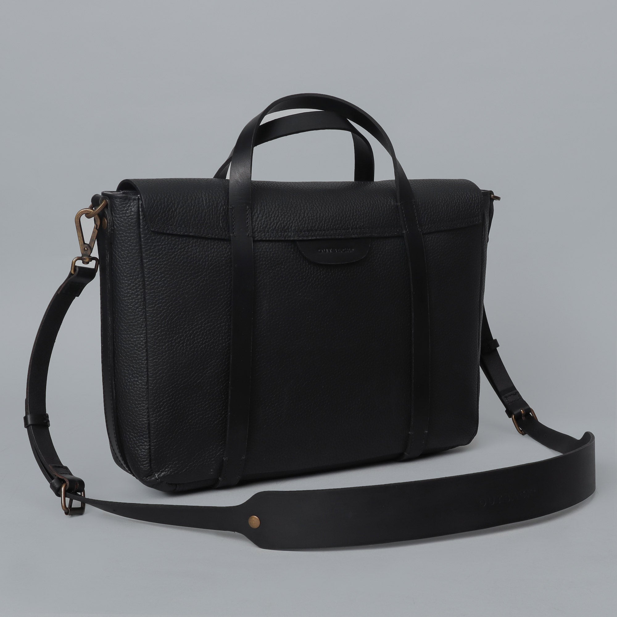 Oslo Leather Briefcase showcasing premium full grain leather, zipper pocket, and magnetic slip pocket for easy access.