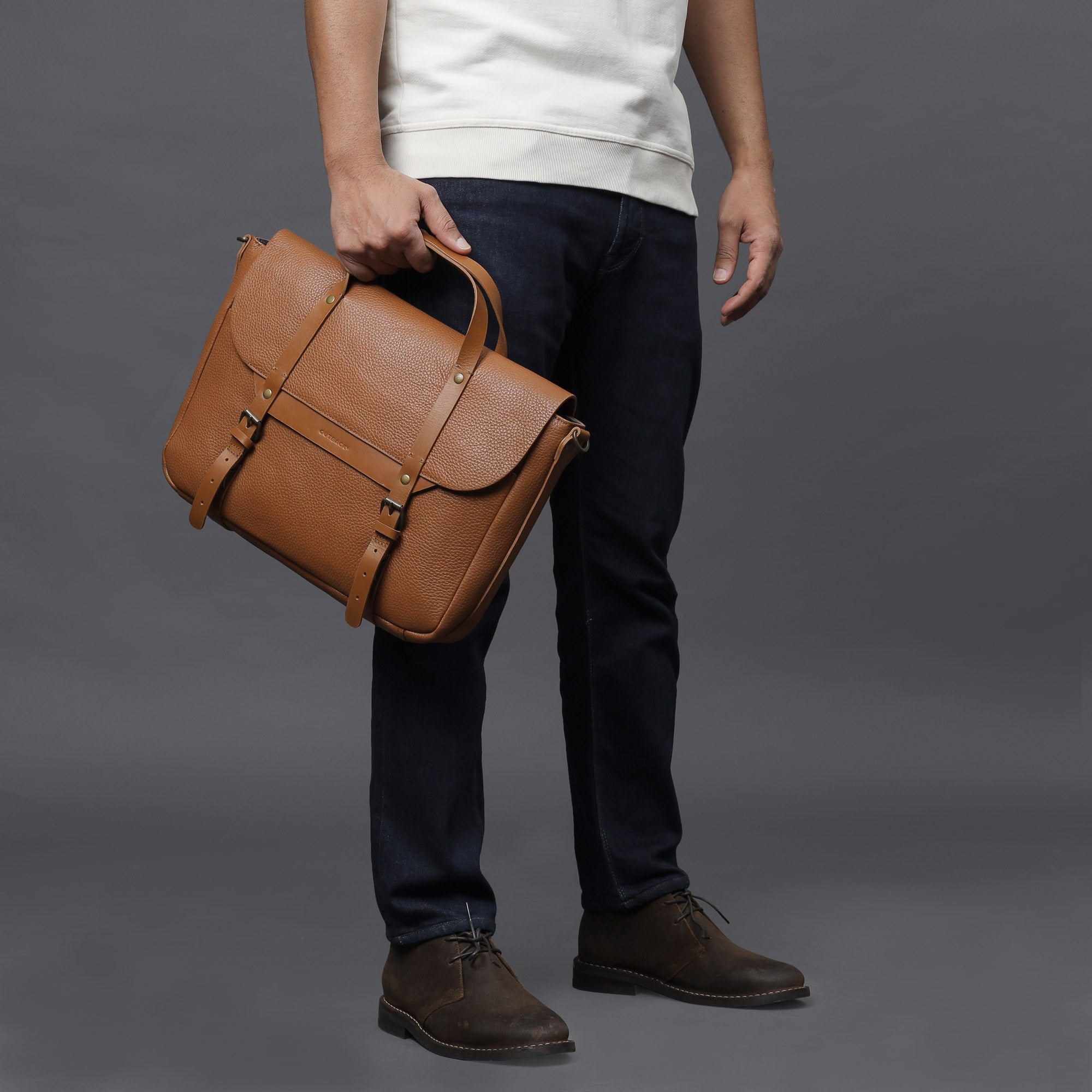 Oslo Leather Briefcase made from premium full grain leather, featuring a separate laptop section, zipper pocket, and magnetic slip pocket.