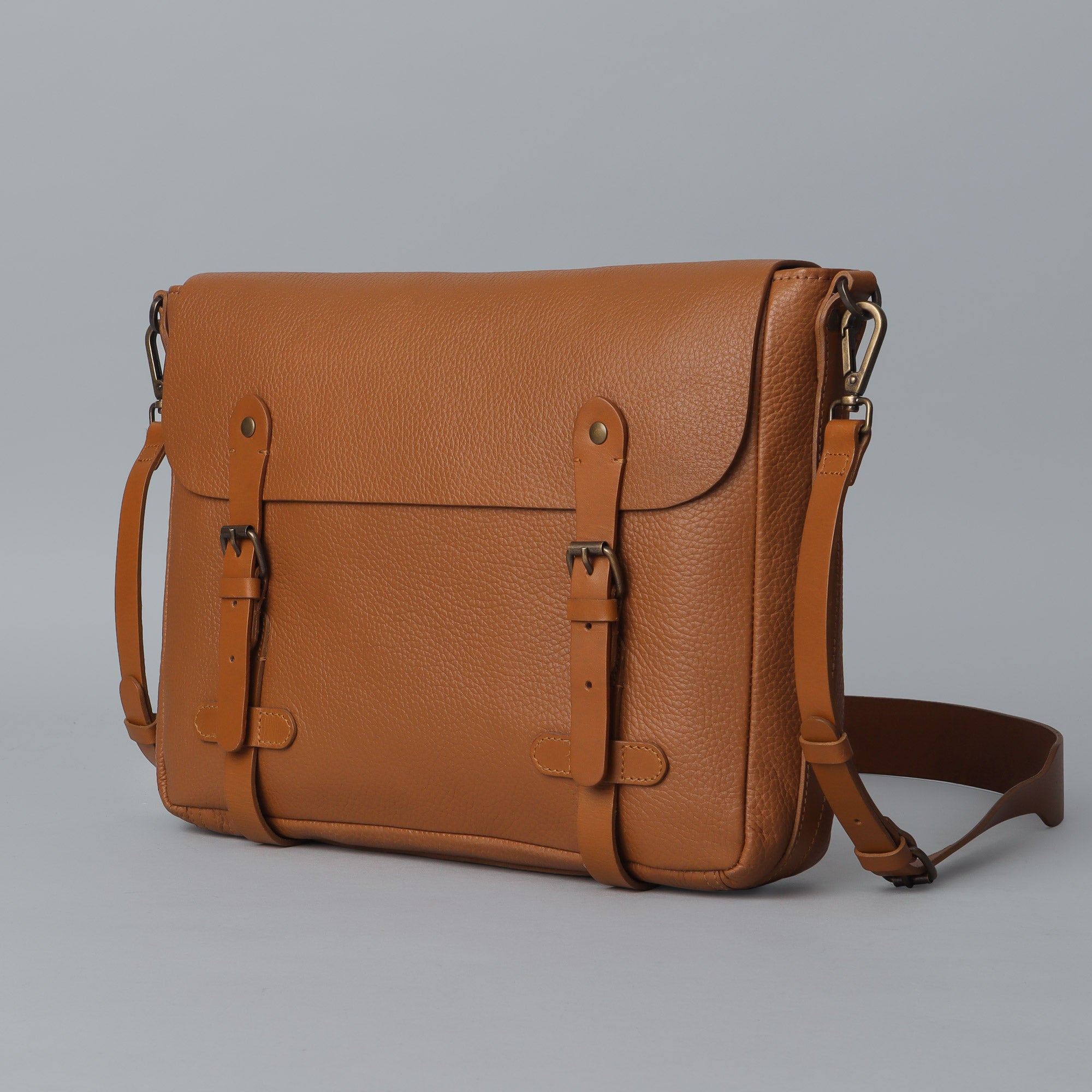 Oslo Leather Messenger Bag made from premium full grain leather, featuring a laptop compartment and stylish design.