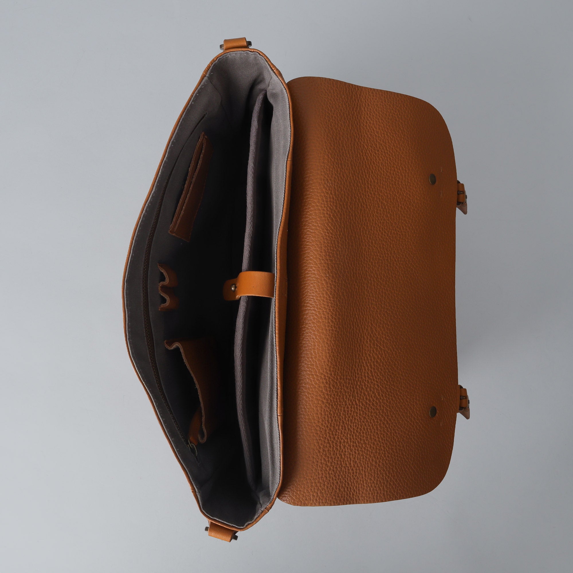 Oslo Leather Messenger Bag made from premium full grain leather, featuring a laptop compartment and stylish design.