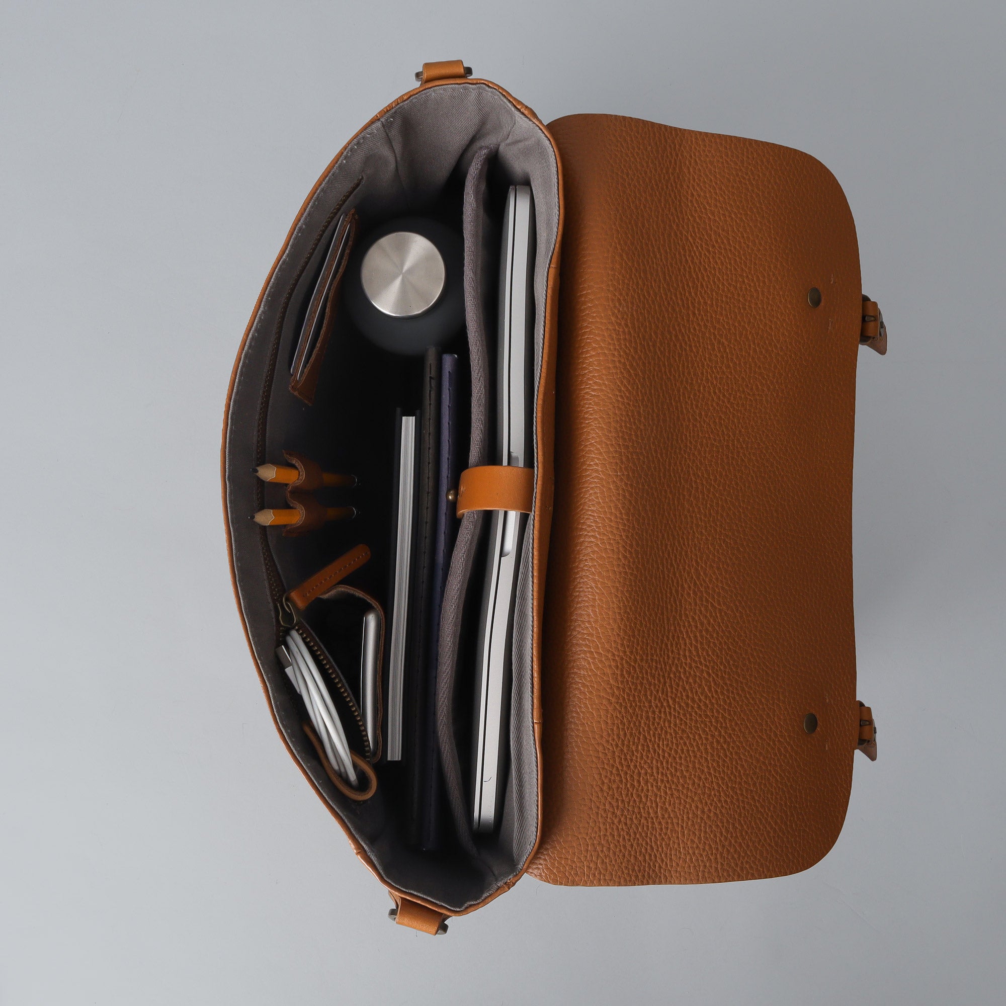 Oslo Leather Messenger Bag made from premium full grain leather, featuring a laptop compartment and stylish design.