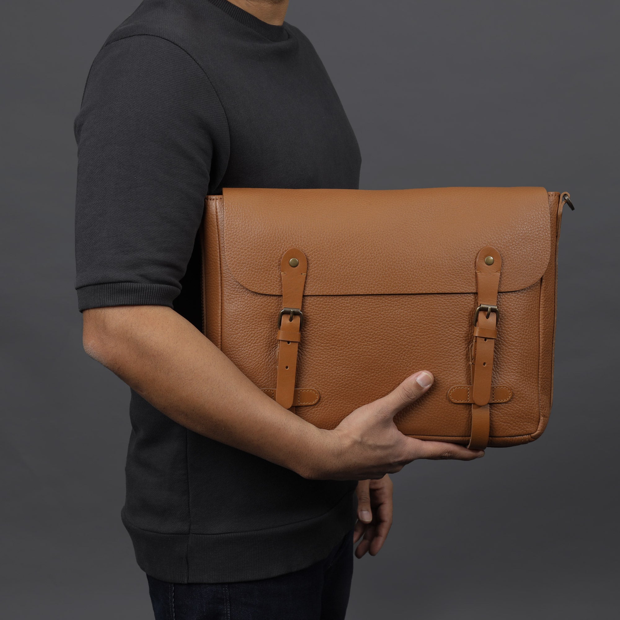 Oslo Leather Messenger Bag made from premium full grain leather, featuring a laptop compartment and stylish design.