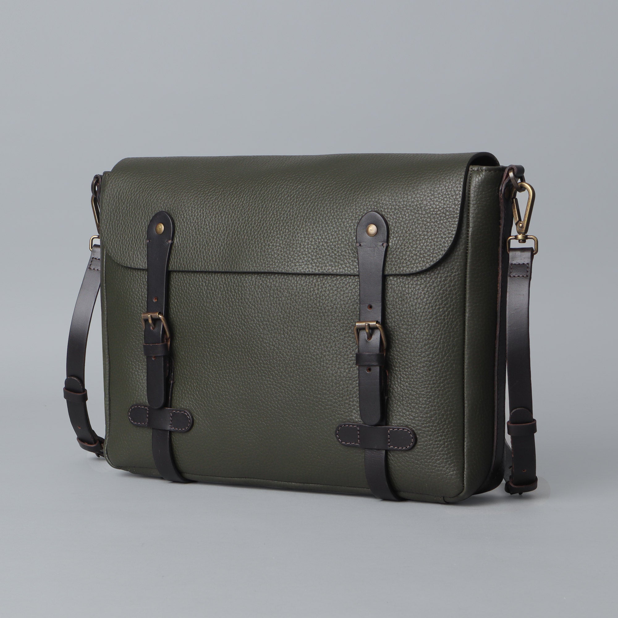 Oslo Leather Messenger Bag made from premium full grain leather, featuring a separate laptop compartment and multiple pockets for organization.