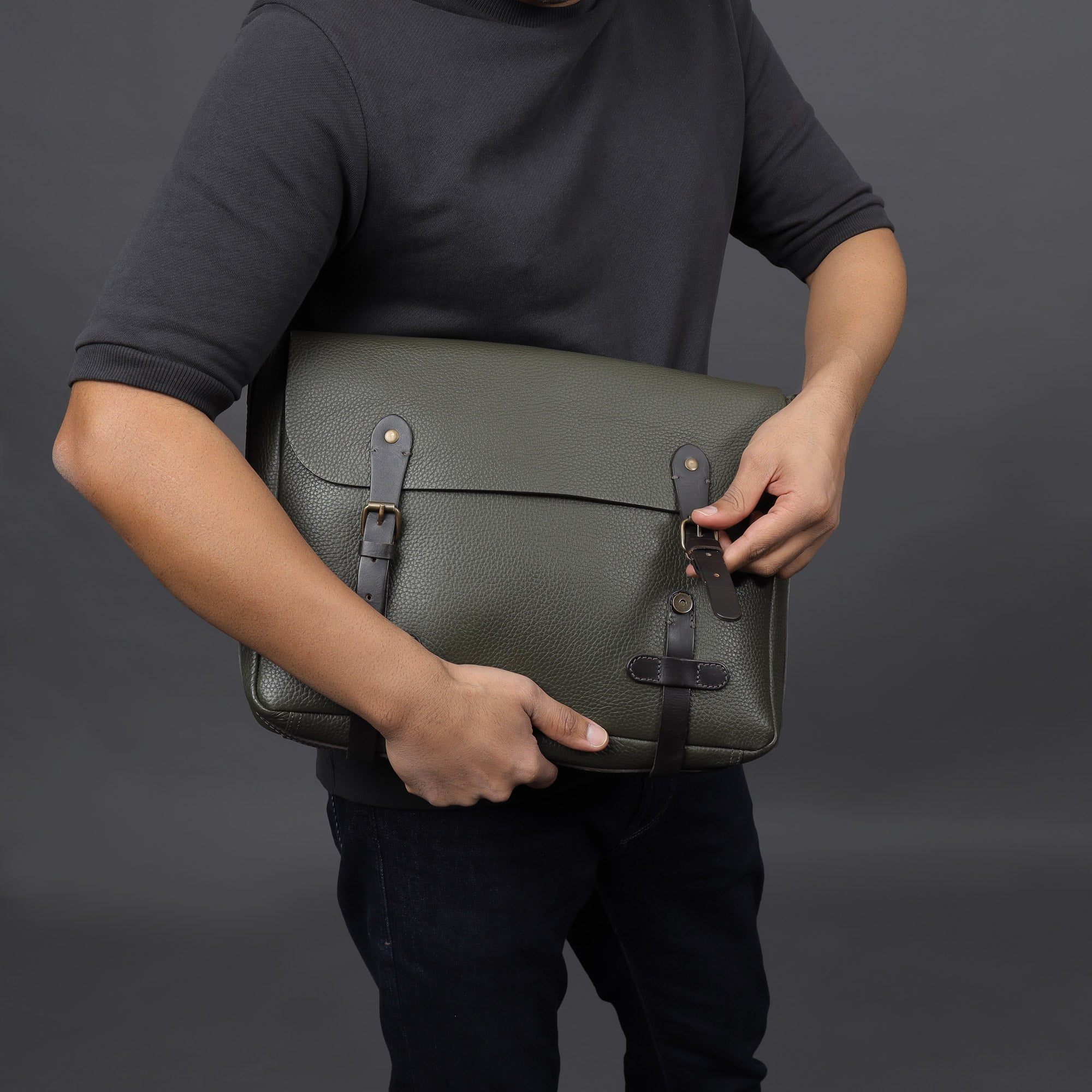 Oslo Leather Messenger Bag made from premium full grain leather, featuring a separate laptop compartment and multiple pockets for organization.