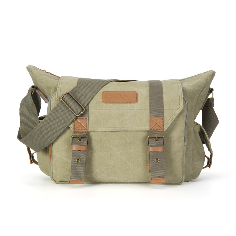 Outdoor Canvas Leisure One-shoulder Camera Bag with tripod straps and large capacity for lenses, designed for photographers.