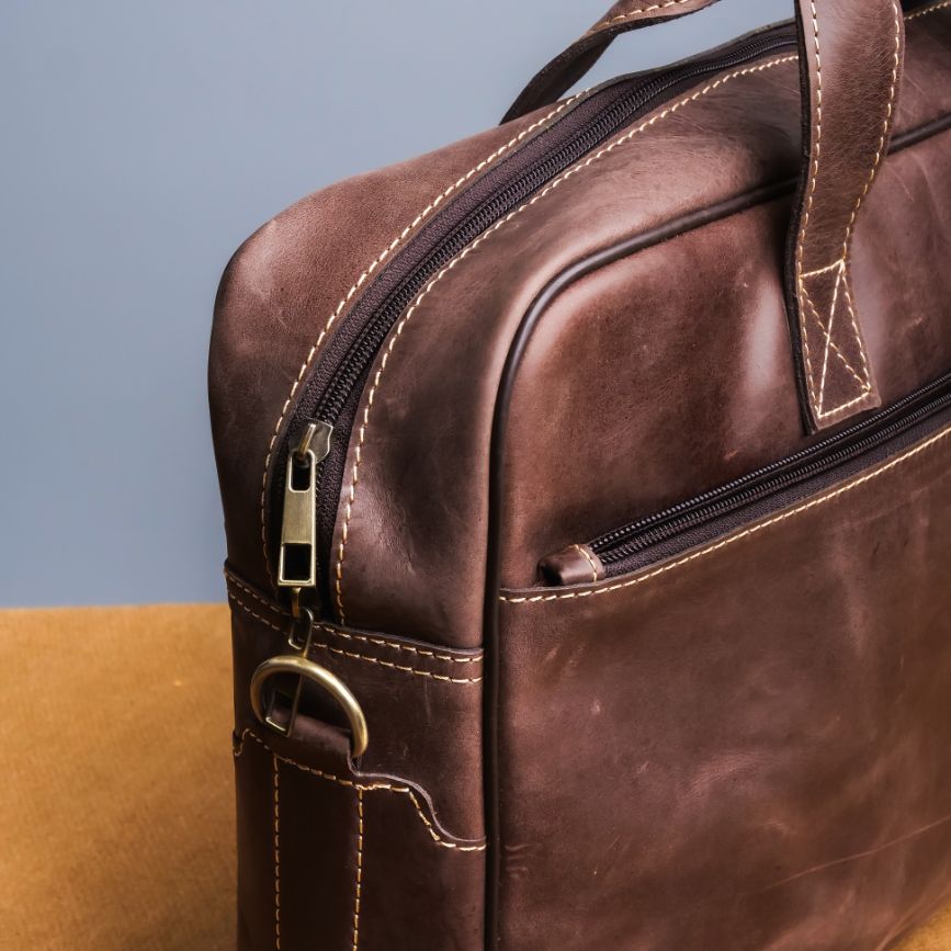 Oxford Pure Leather Vintage Business Laptop Bag in dark brown, showcasing its elegant design and multiple compartments.