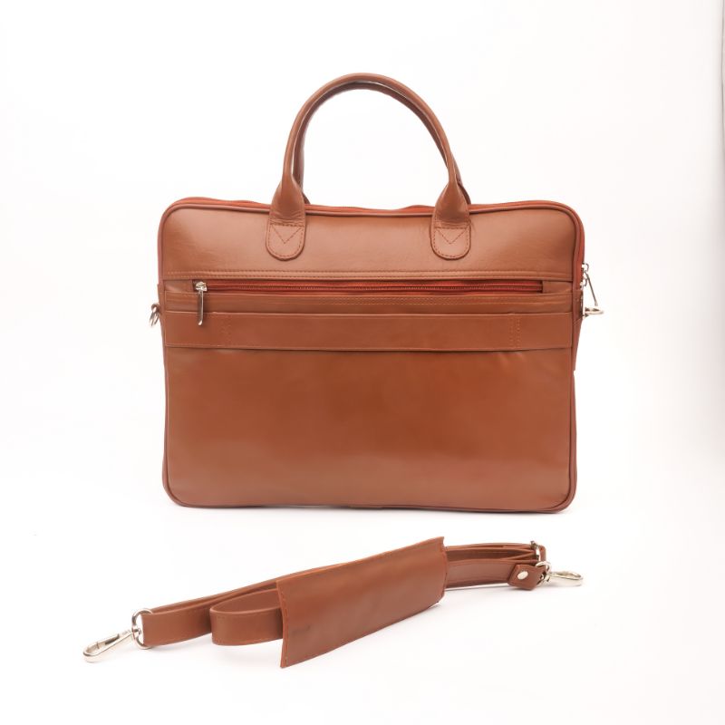 Parker Slim Leather Laptop Bag in Tan, showcasing its sleek design, adjustable shoulder strap, and multiple compartments for organization.