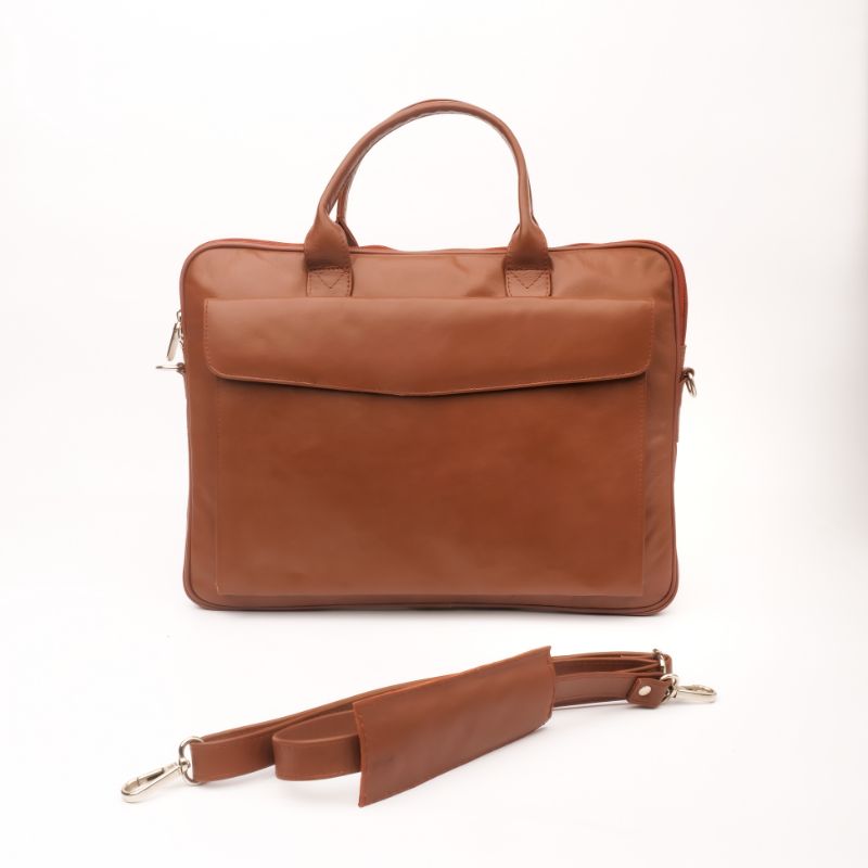 Parker Slim Leather Laptop Bag in Tan, showcasing its sleek design, adjustable shoulder strap, and multiple compartments for organization.