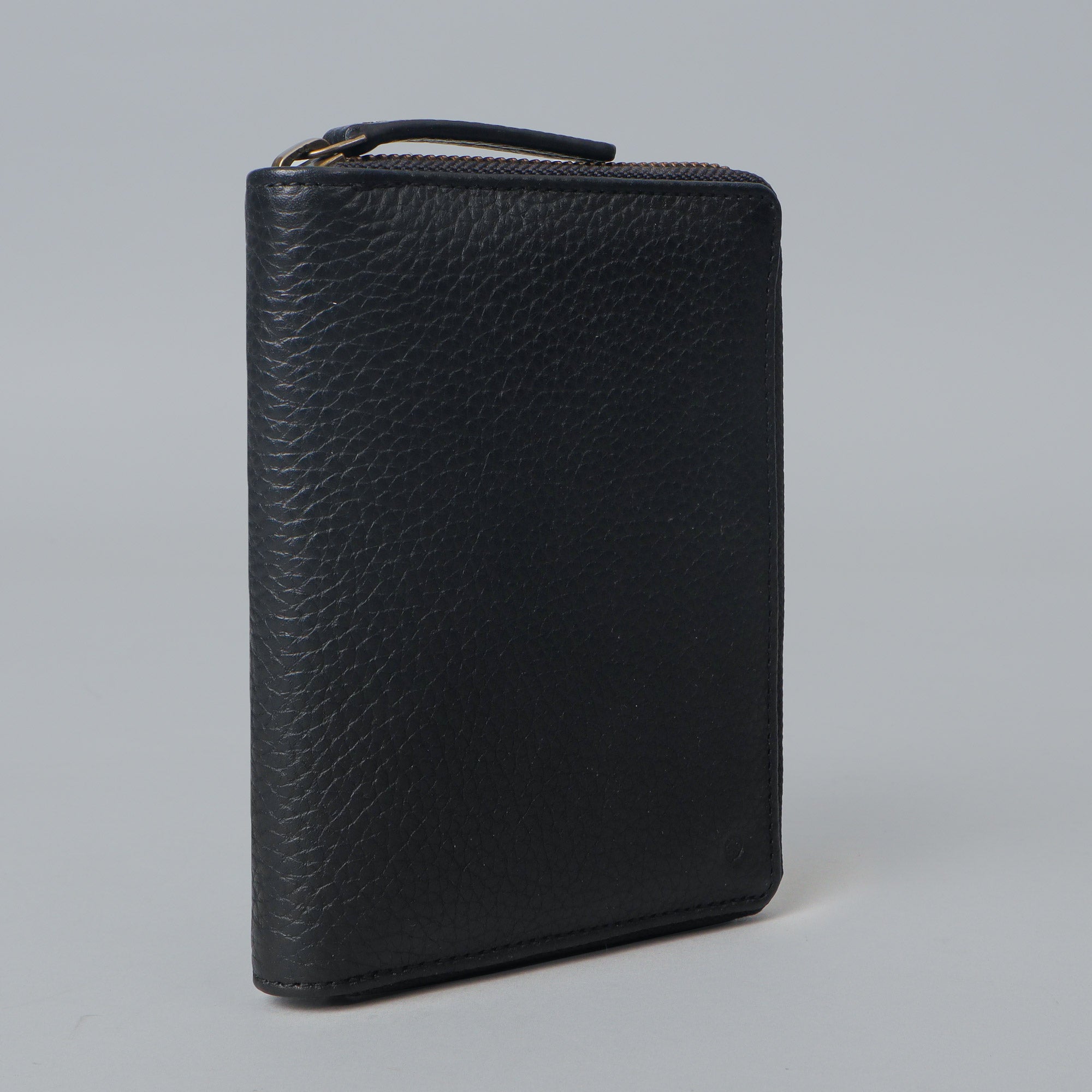 A premium leather passport wallet featuring multiple card pockets, slip pockets for passport and boarding pass, and a secure zipper closure.