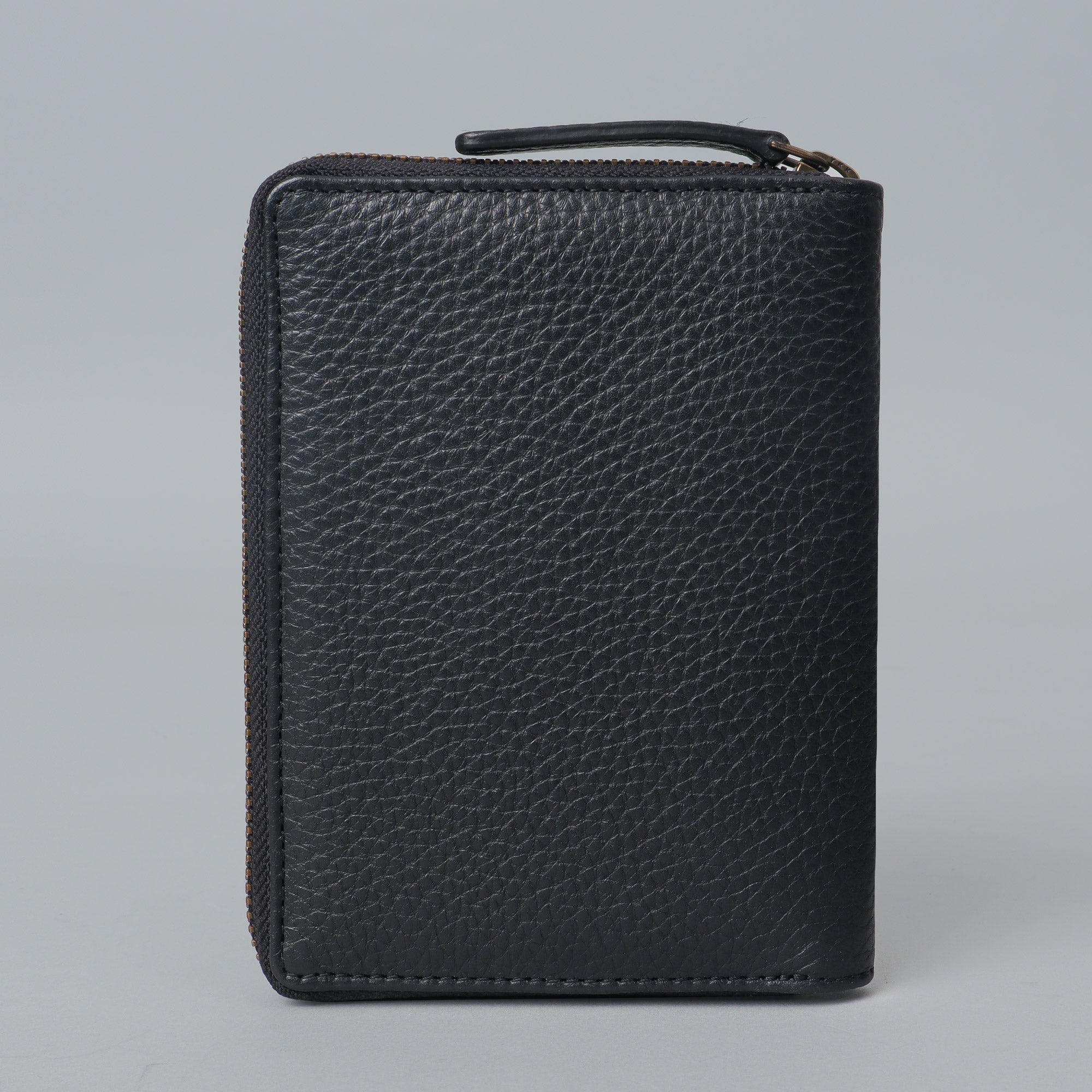 A premium leather passport wallet featuring multiple card pockets, slip pockets for passport and boarding pass, and a secure zipper closure.