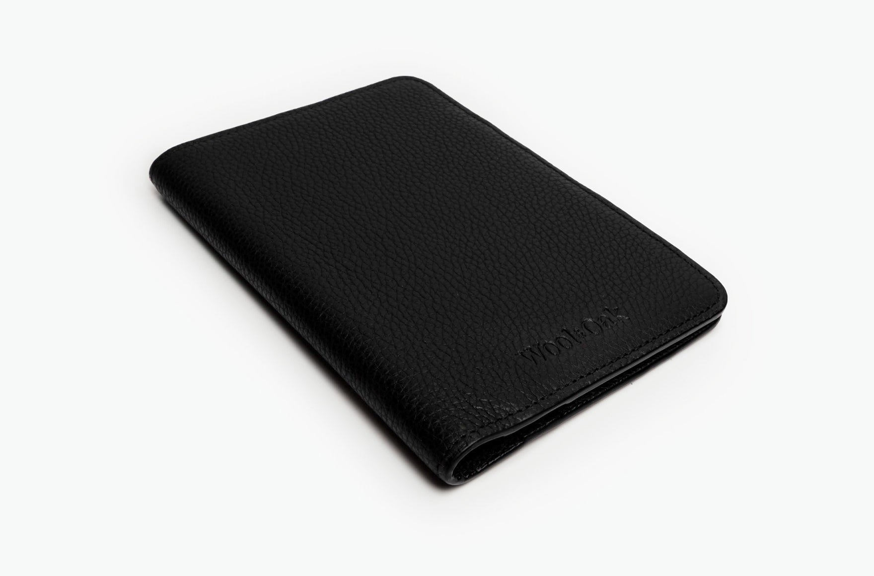 A stylish and functional passport wallet designed for travelers, featuring multiple slots for passports and cards, made from durable material.