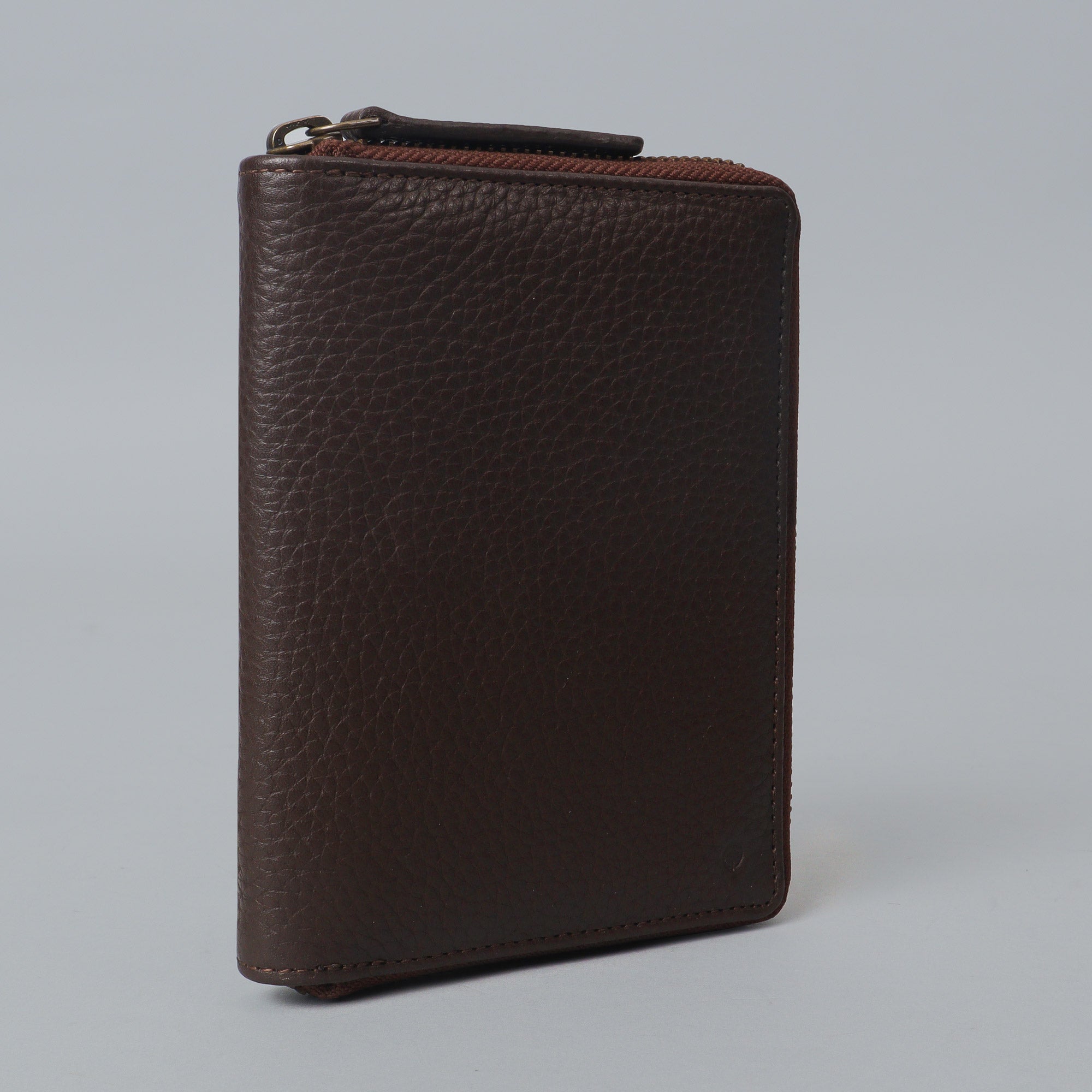 A premium leather passport wallet with multiple pockets and a zipper closure, showcasing its elegant design and craftsmanship.