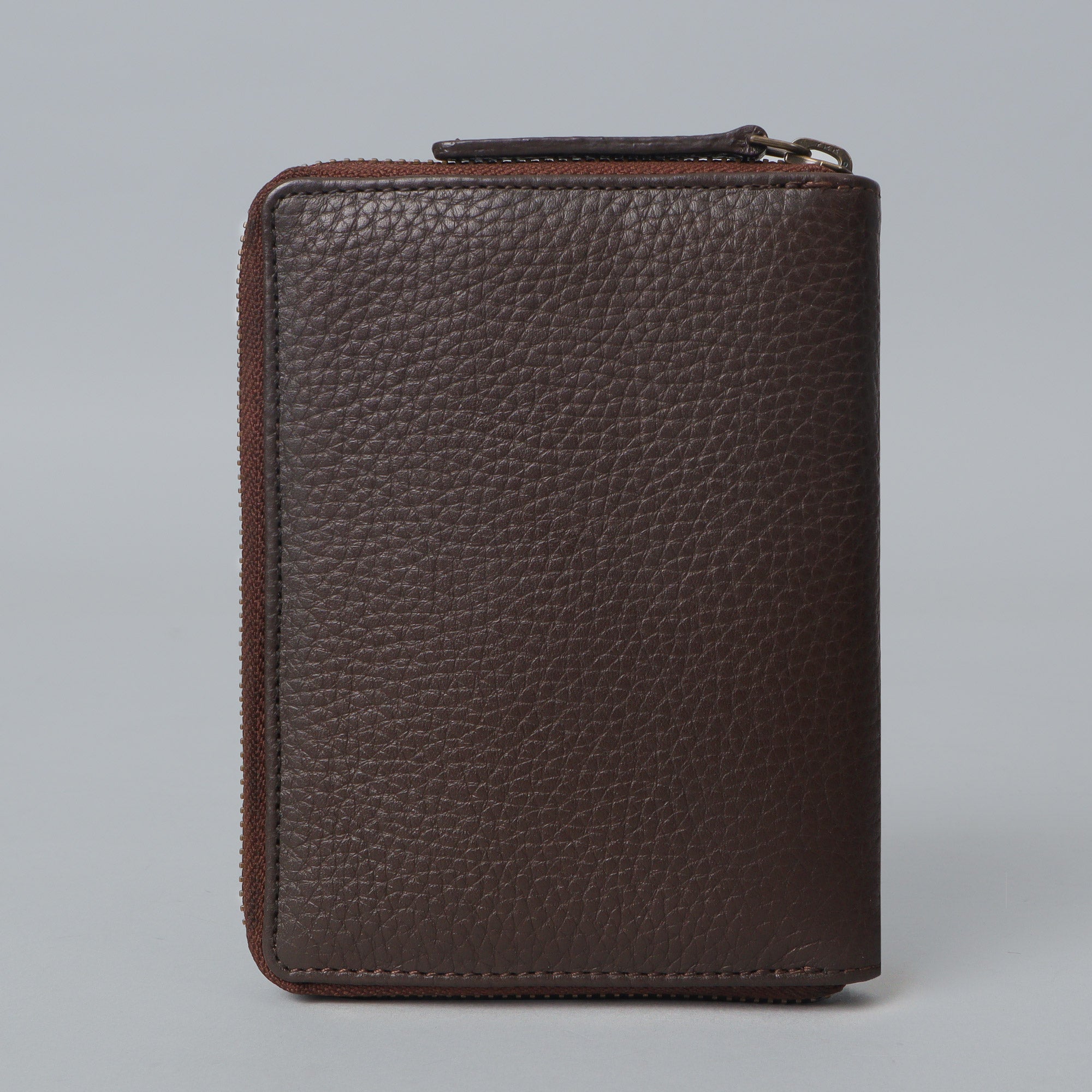 A premium leather passport wallet with multiple pockets and a zipper closure, showcasing its elegant design and craftsmanship.