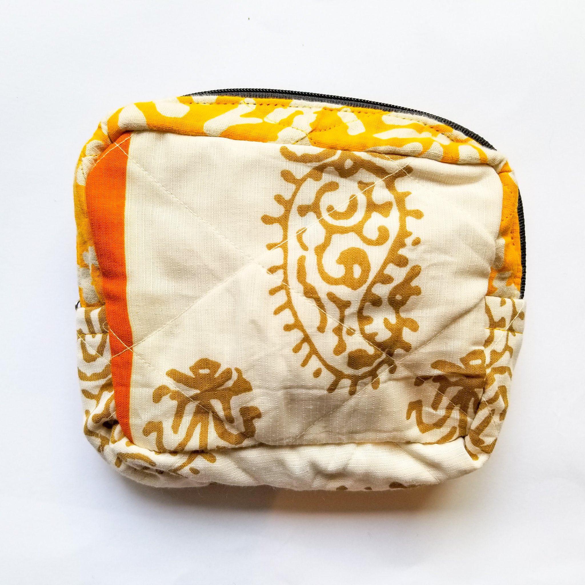 Colorful patchwork sari box pouch handcrafted by artisans in India, showcasing unique patterns and vibrant colors.