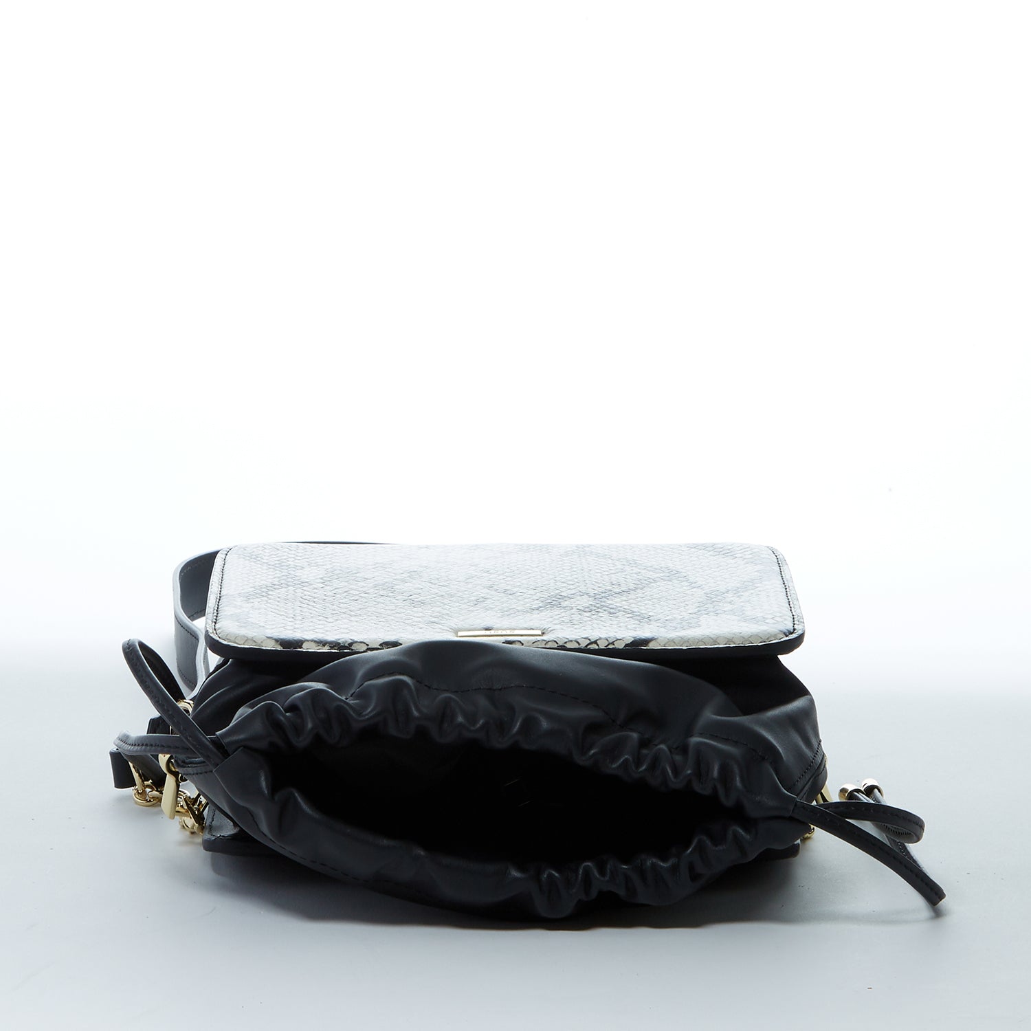 Patricia Black Leather Bucket Bag featuring a unique snakeskin design with gold hardware and teal interior.