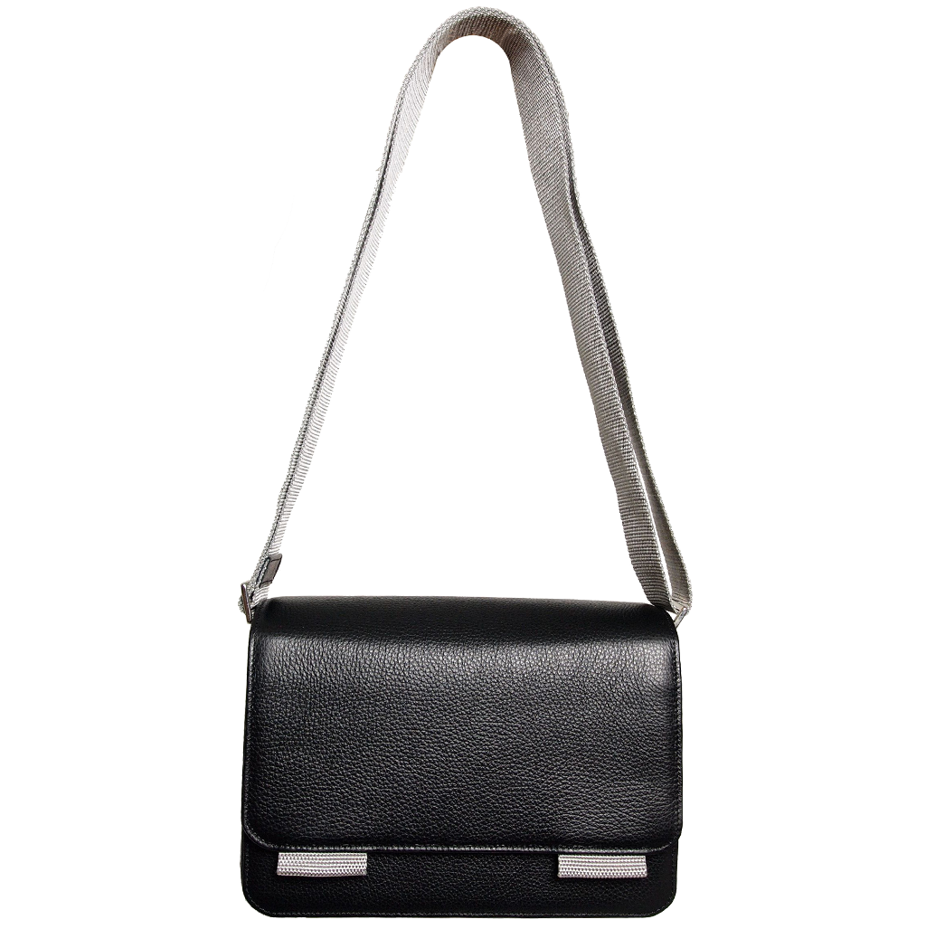 A stylish black pebbled leather crossbody bag with a contrasting vinyl strap, featuring a magnetic flap closure and handmade craftsmanship from Milan, Italy.