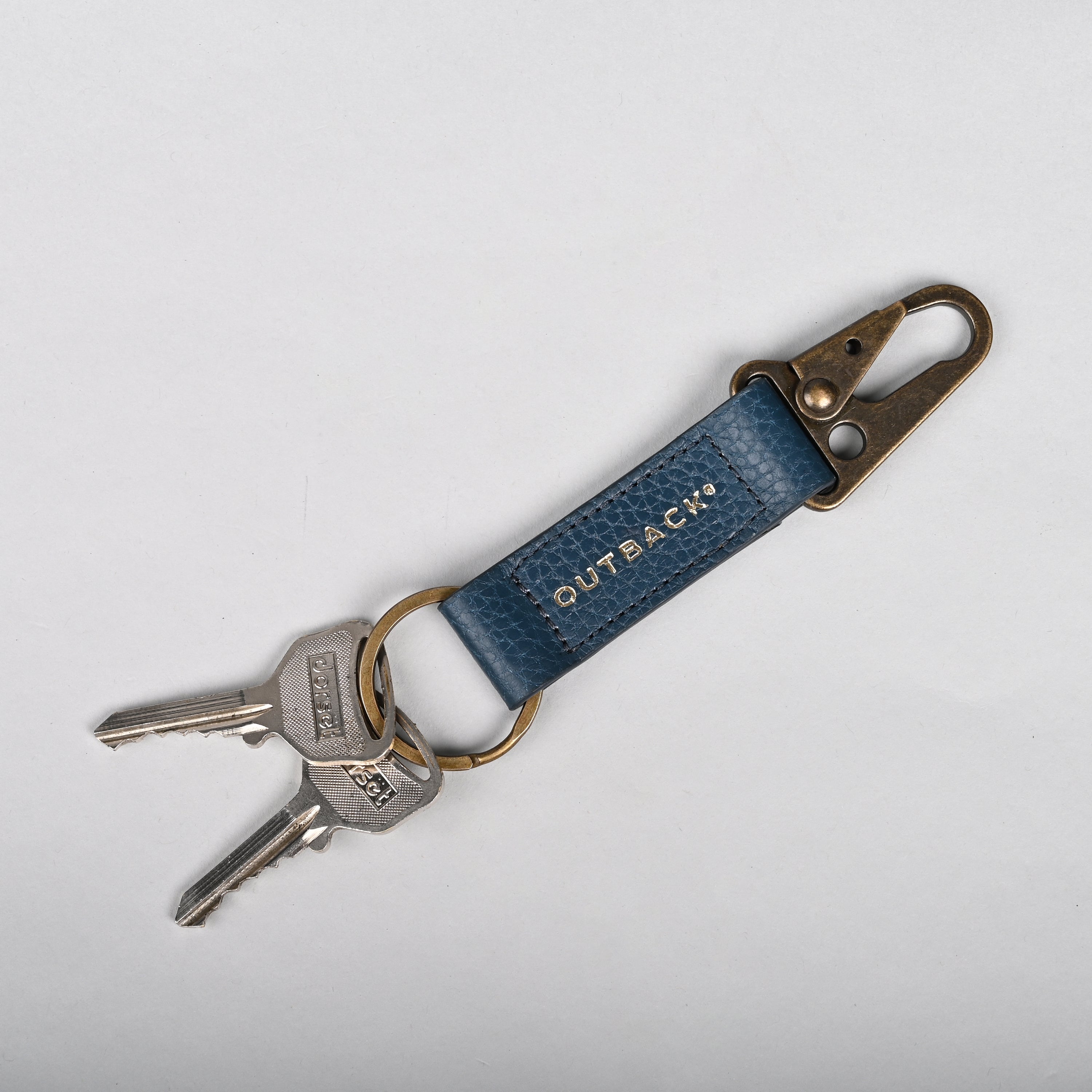 Performance Key Holder made from premium full grain leather with antique brass hardware, featuring a snap hook mechanism.