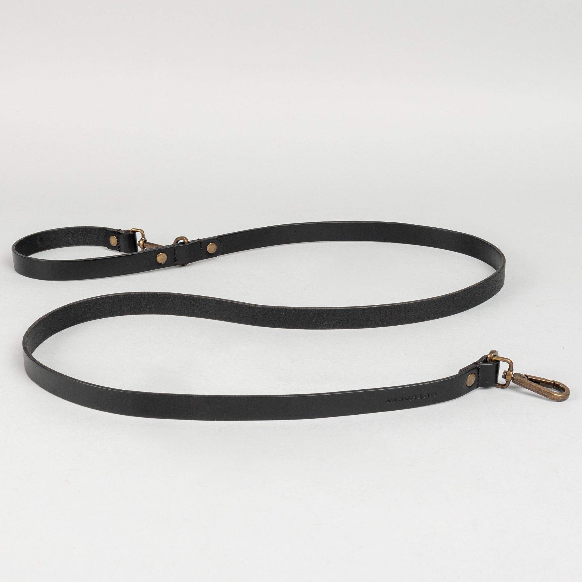 Premium heavy-duty pet leash made from durable leather with antique brass hardware, adjustable to three lengths for versatile use.