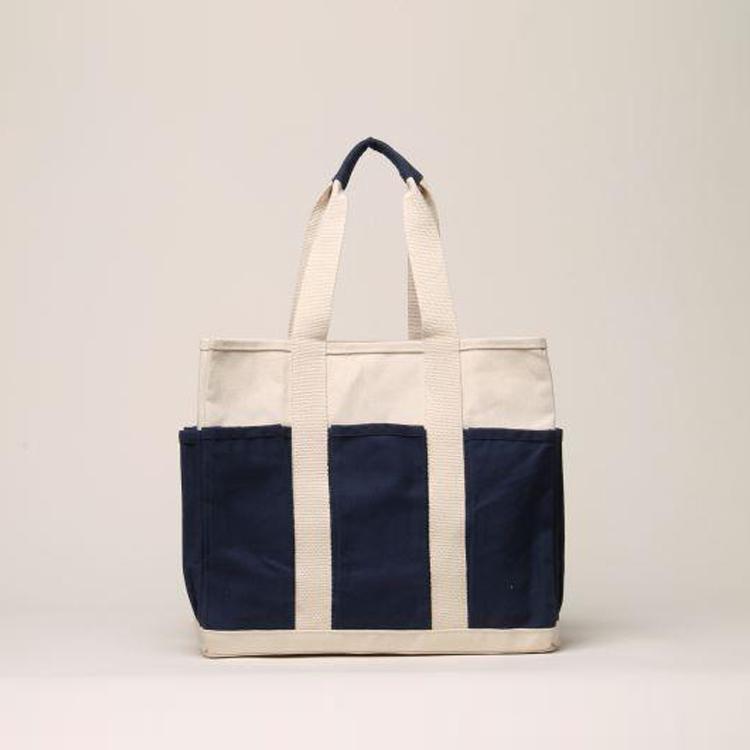 A medium-sized Pocket Tote made from heavy-duty recycled cotton canvas, featuring eight external gusseted pockets for organization.