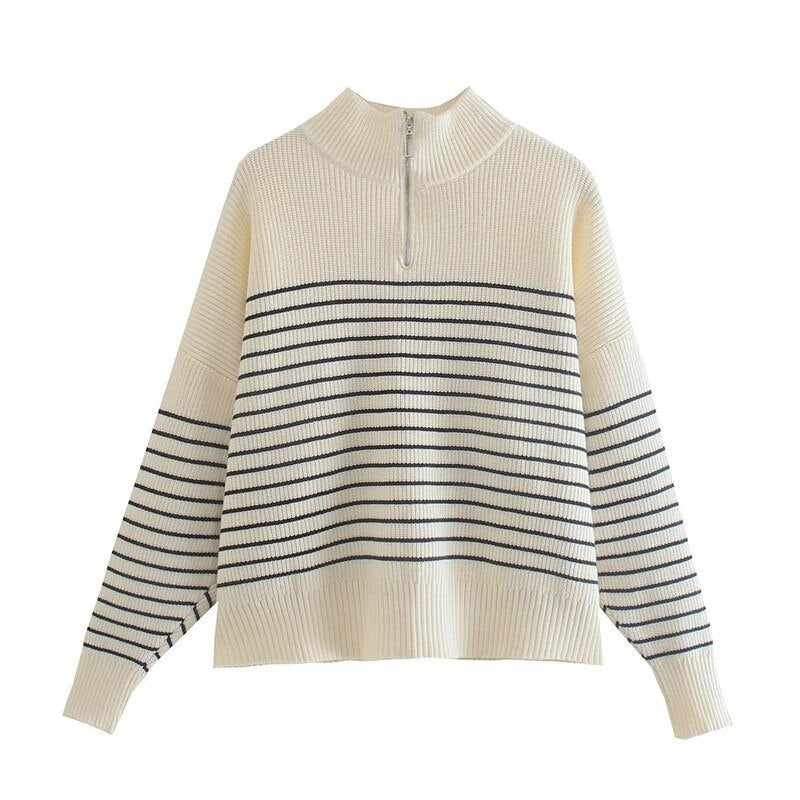 A stylish women's knit striped sweater featuring a turtleneck collar and full-length sleeves, perfect for autumn and winter wear.