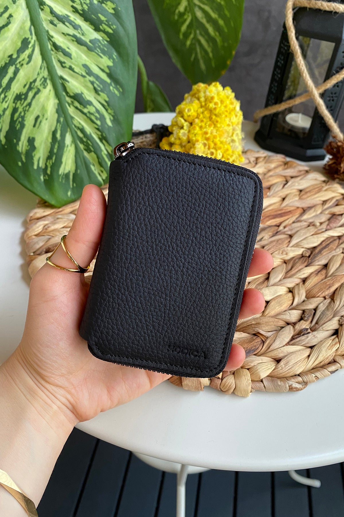 Porto Genuine Leather Wallet featuring a zipper, showcasing its elegant design and multiple card slots.