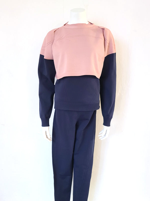 Poseasy Yoga set featuring a wholegarment knitted top and leggings in navy/pink and light pink/pink color combinations.