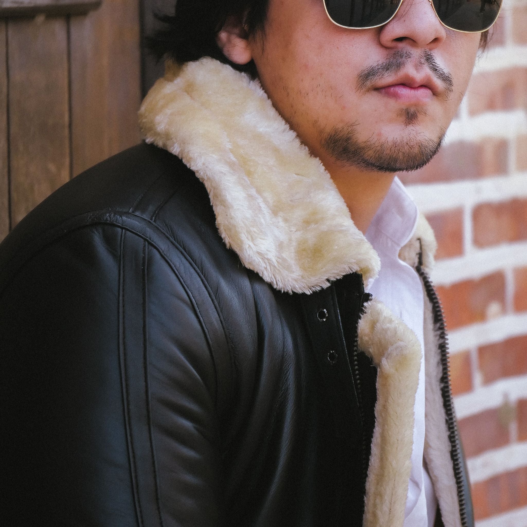 Premium Shearling Fur Leather Jacket in Black, featuring genuine sheepskin leather, full fur lining, and stylish bomber design.