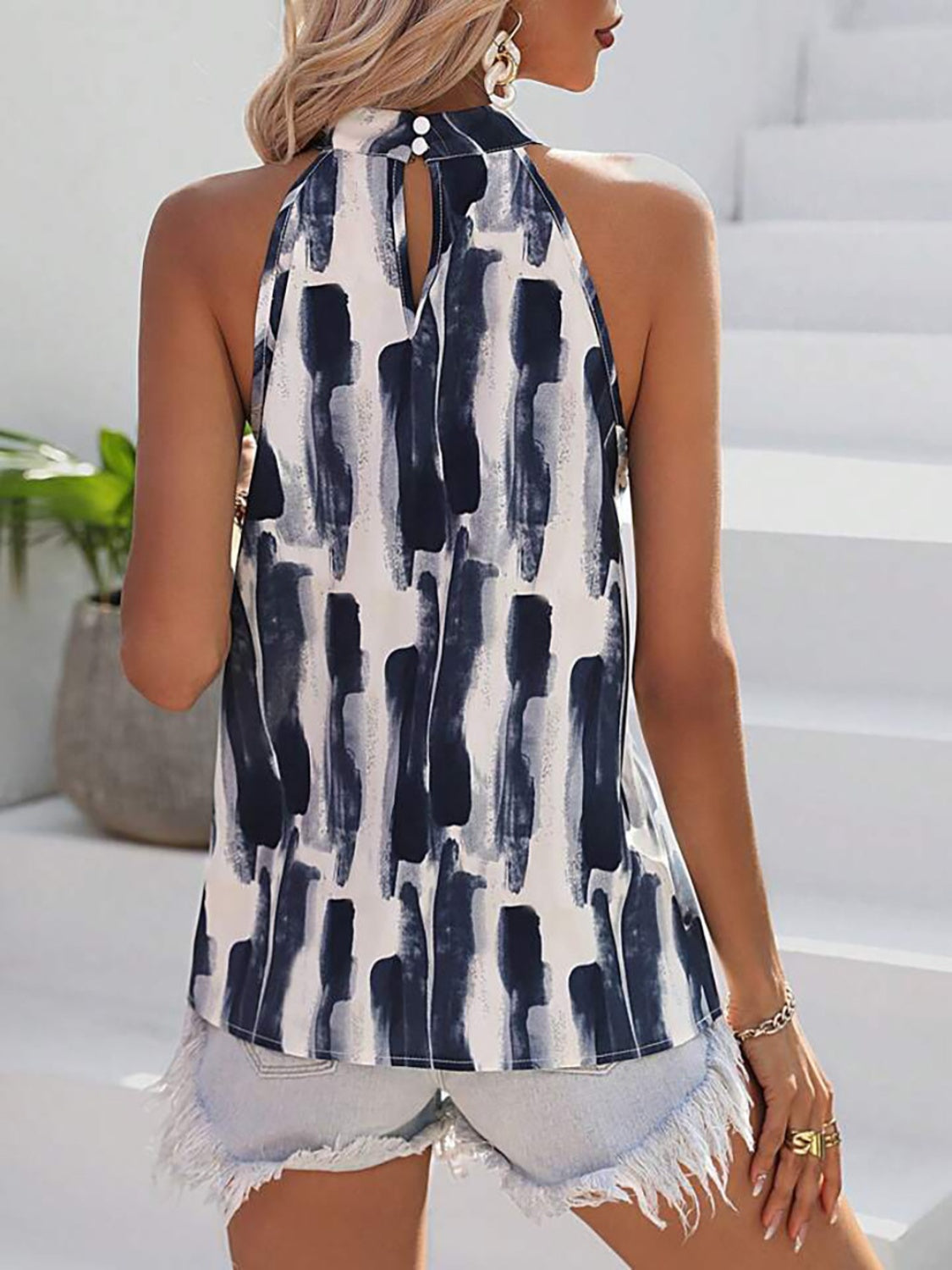 A stylish Printed Mock Neck Tank top in a vibrant print, showcasing its elegant design and high-quality fabric.