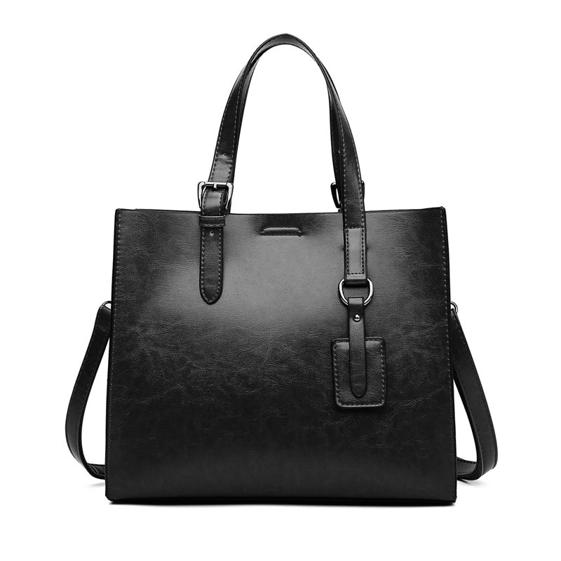 A stylish PU leather women's messenger bag in solid color, featuring a soft handle and zipper pocket.