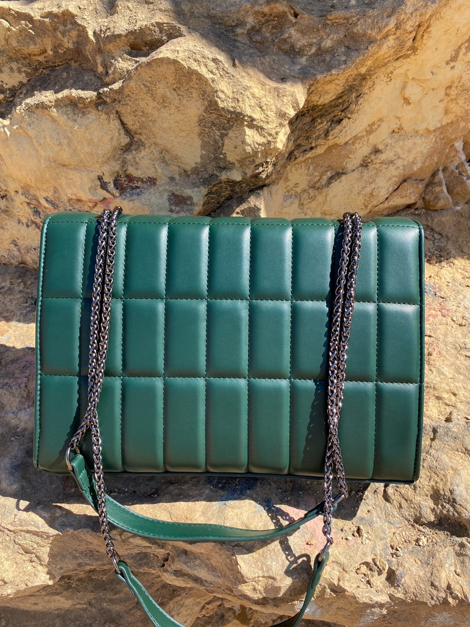 Quilted chain strap shoulder bag in blue, pink, and green colors with a stylish design and double chain-link straps.