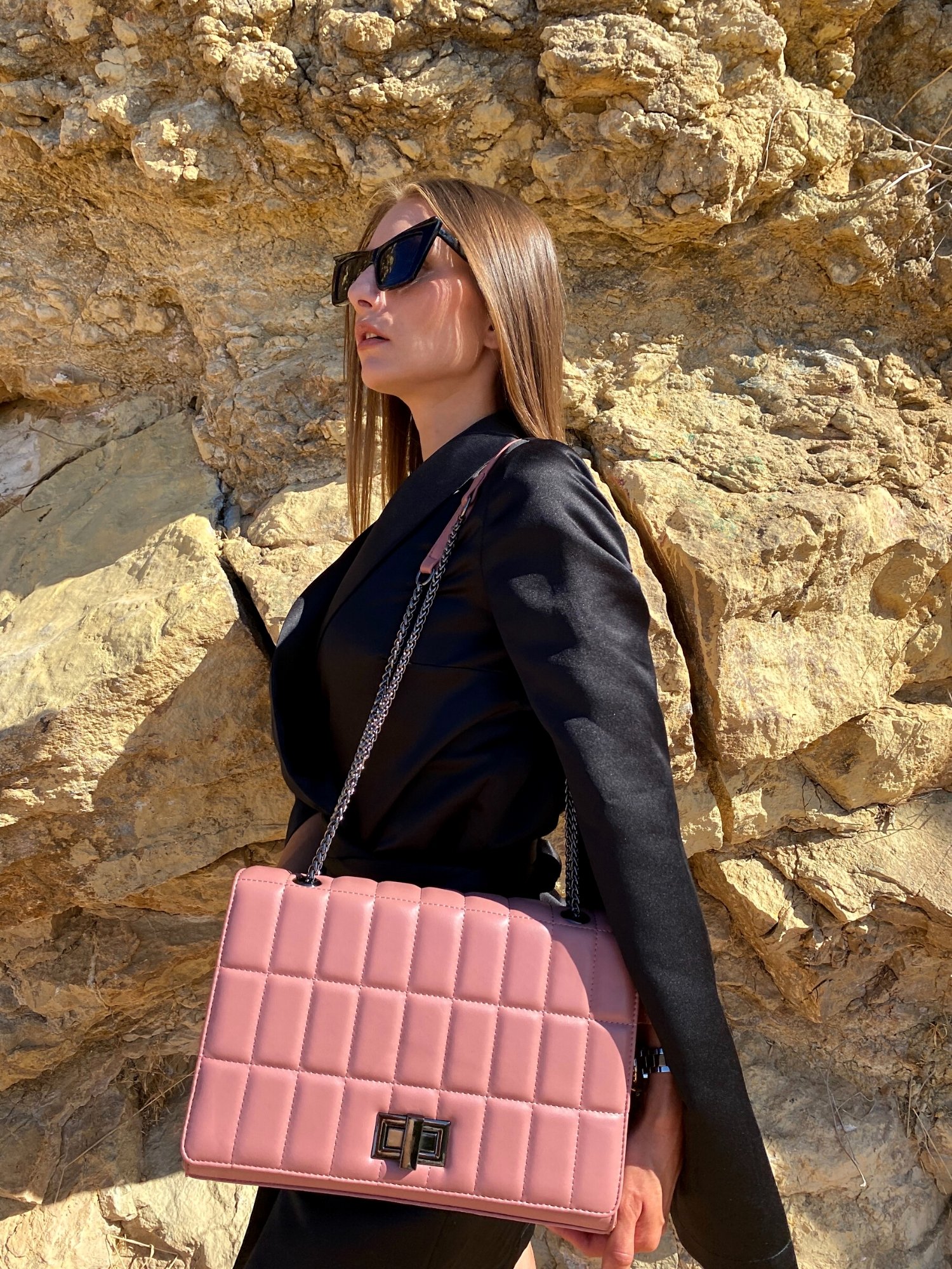 Quilted chain strap shoulder bag in pink, blue, and green colors with a stylish quilted exterior and double chain straps.