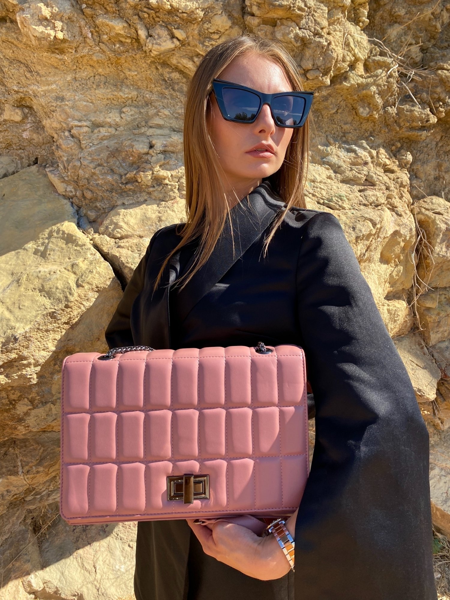 Quilted chain strap shoulder bag in pink, blue, and green colors with a stylish quilted exterior and double chain straps.