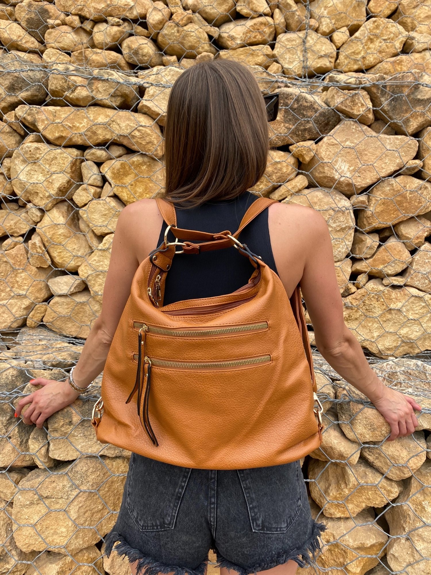 Stylish Quilted Pink Backpack with adjustable straps and zipped compartments, showcasing a chic design.