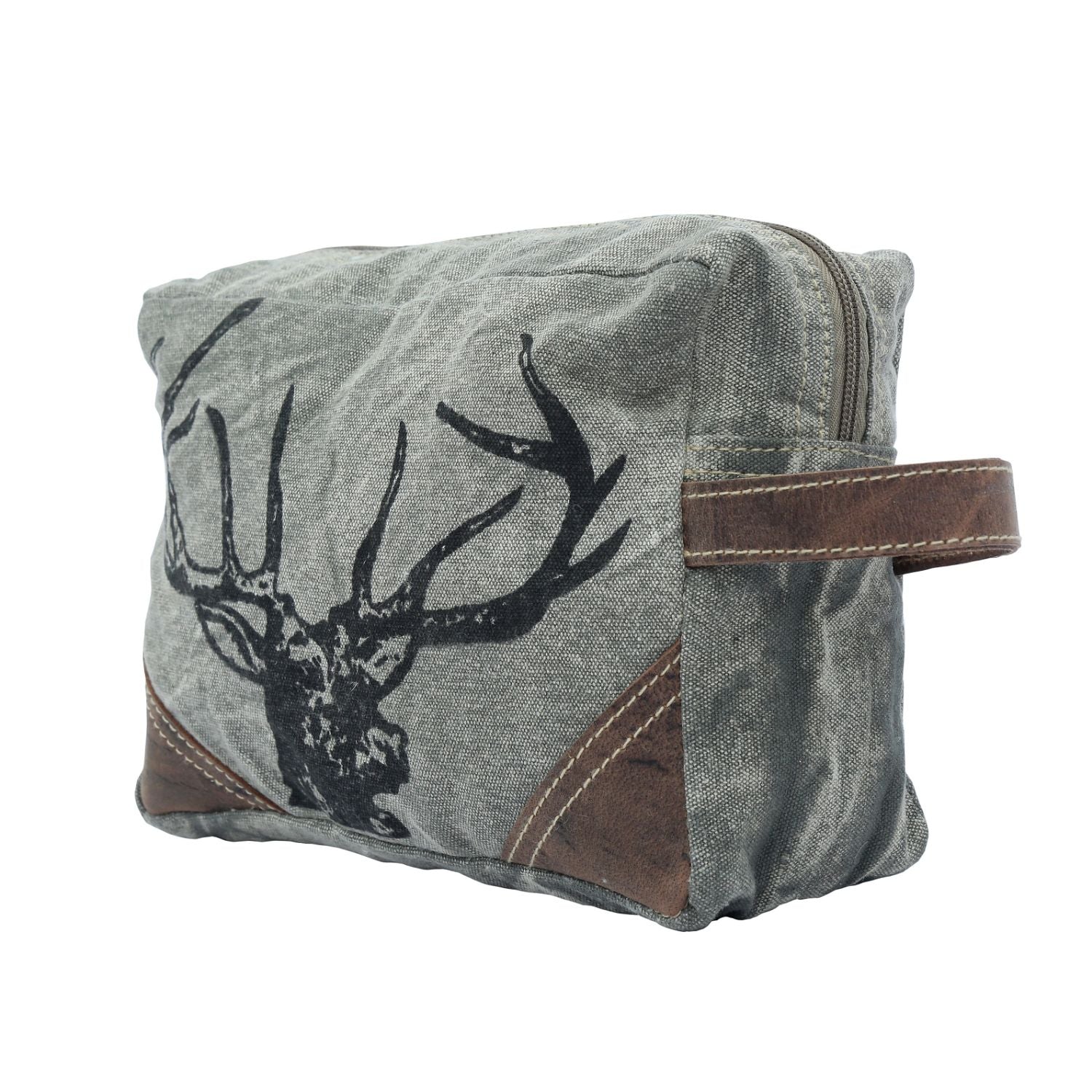 Revel Dopp Kit featuring upcycled canvas with a deer print and leather accents, ideal for carrying daily essentials.