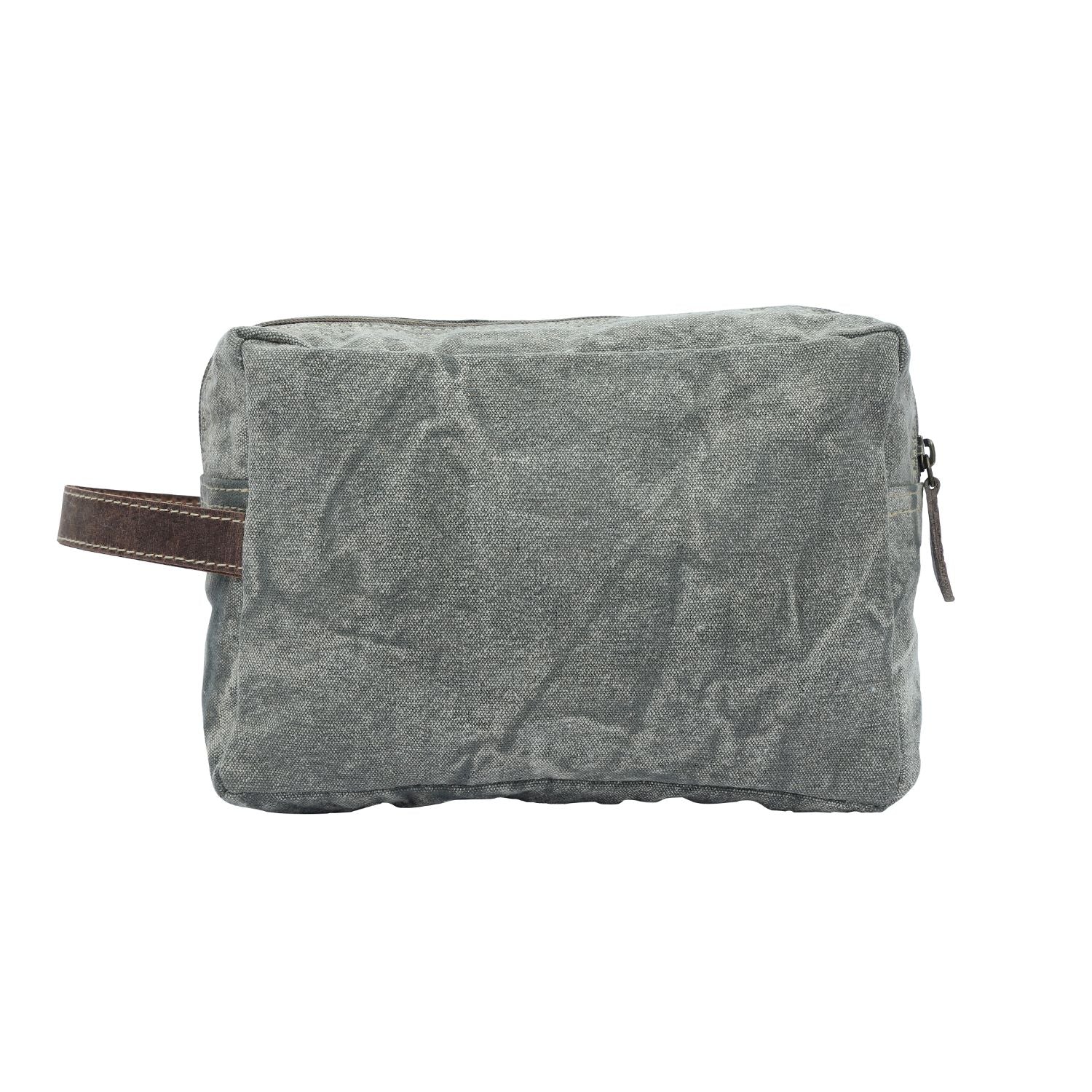 Revel Dopp Kit featuring upcycled canvas with a deer print and leather accents, ideal for carrying daily essentials.