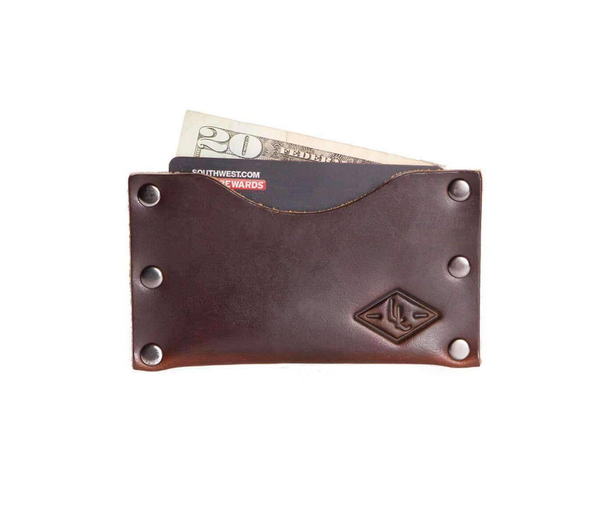 Rivet Wallet made of genuine full grain leather with stainless steel rivets, showcasing its minimalist design and personalization option.