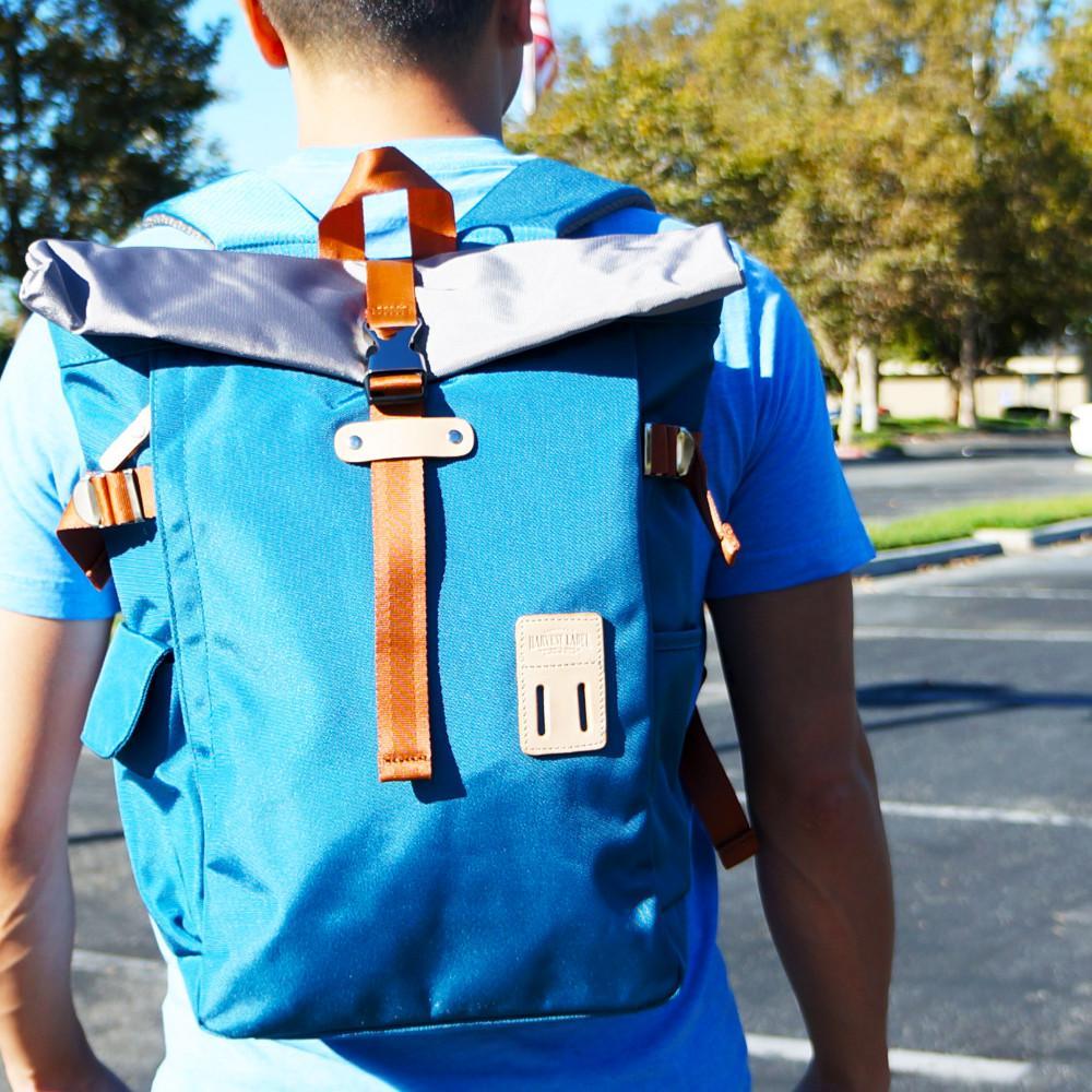 ROLLTOP BACKPACK 2.0 in various colors showcasing its modern design and multiple pockets.