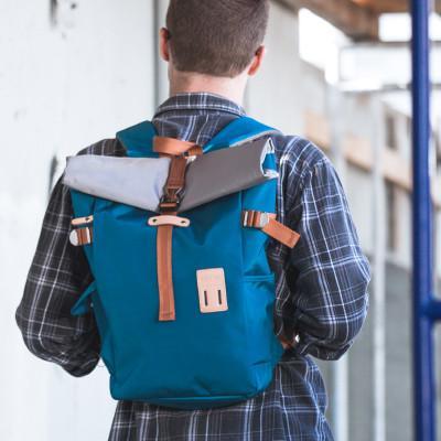 ROLLTOP BACKPACK 2.0 in various colors showcasing its modern design and multiple pockets.