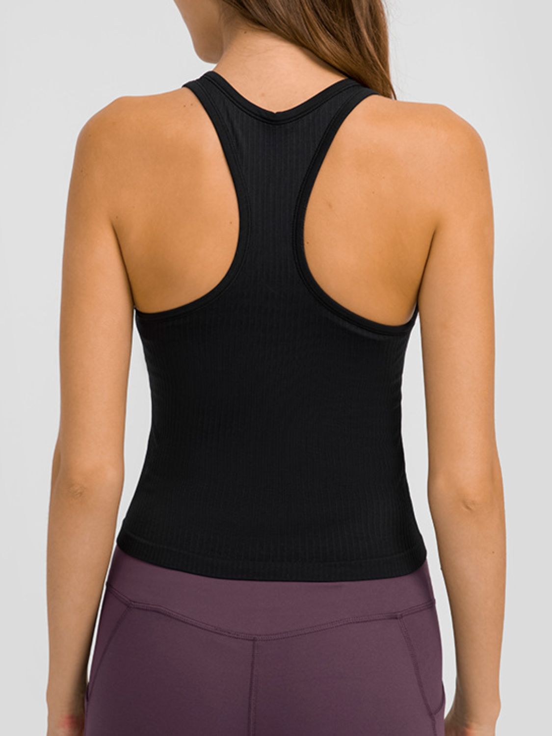 Round Neck Racerback Active Tank in various colors, showcasing removable padding and a comfortable fit.