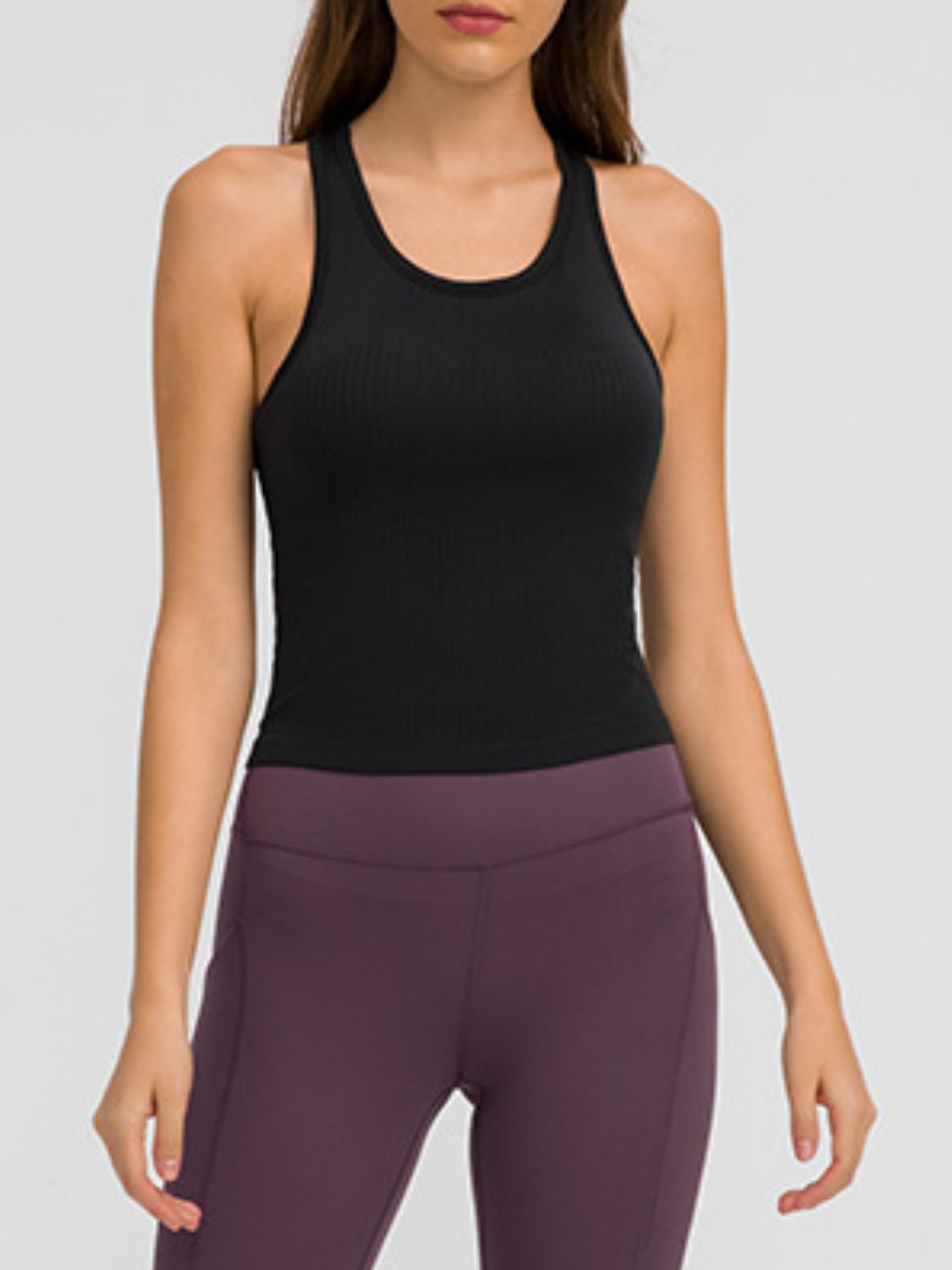 Round Neck Racerback Active Tank in various colors, showcasing removable padding and a comfortable fit.