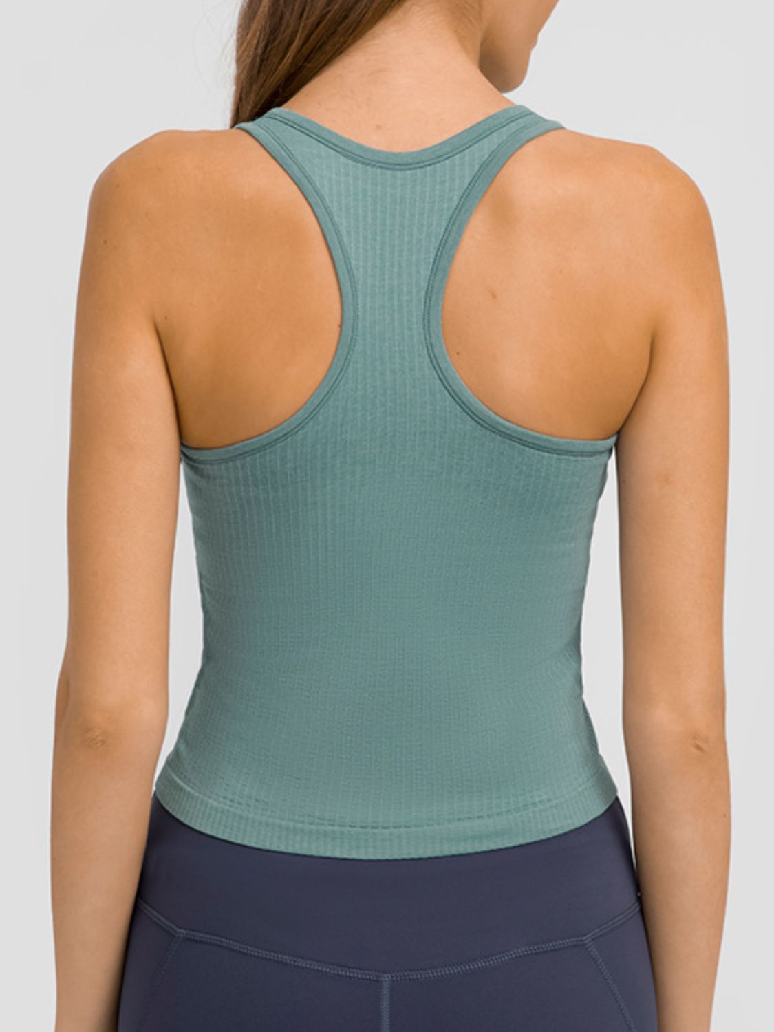 Round Neck Racerback Active Tank in various colors, showcasing removable padding and a comfortable fit.