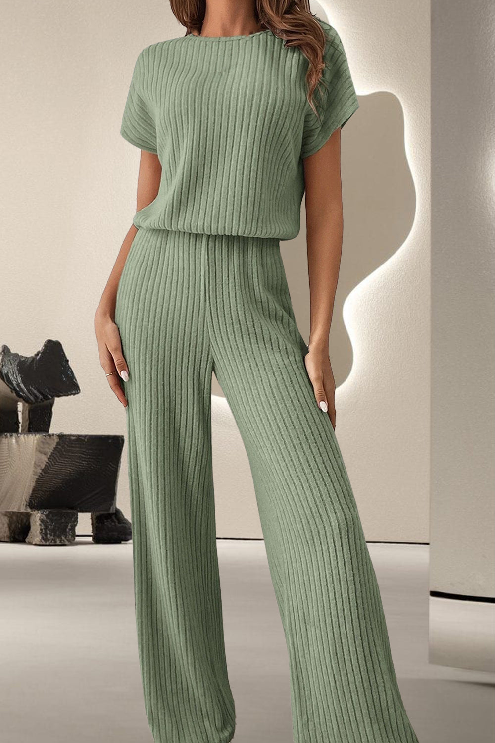 A stylish Round Neck Short Sleeve Jumpsuit displayed on a mannequin, showcasing its chic design and comfortable fit.