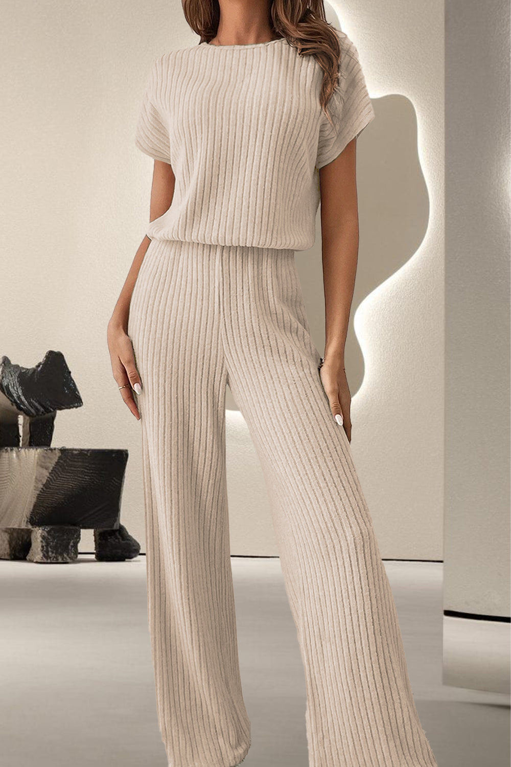 A stylish Round Neck Short Sleeve Jumpsuit displayed on a mannequin, showcasing its chic design and comfortable fit.