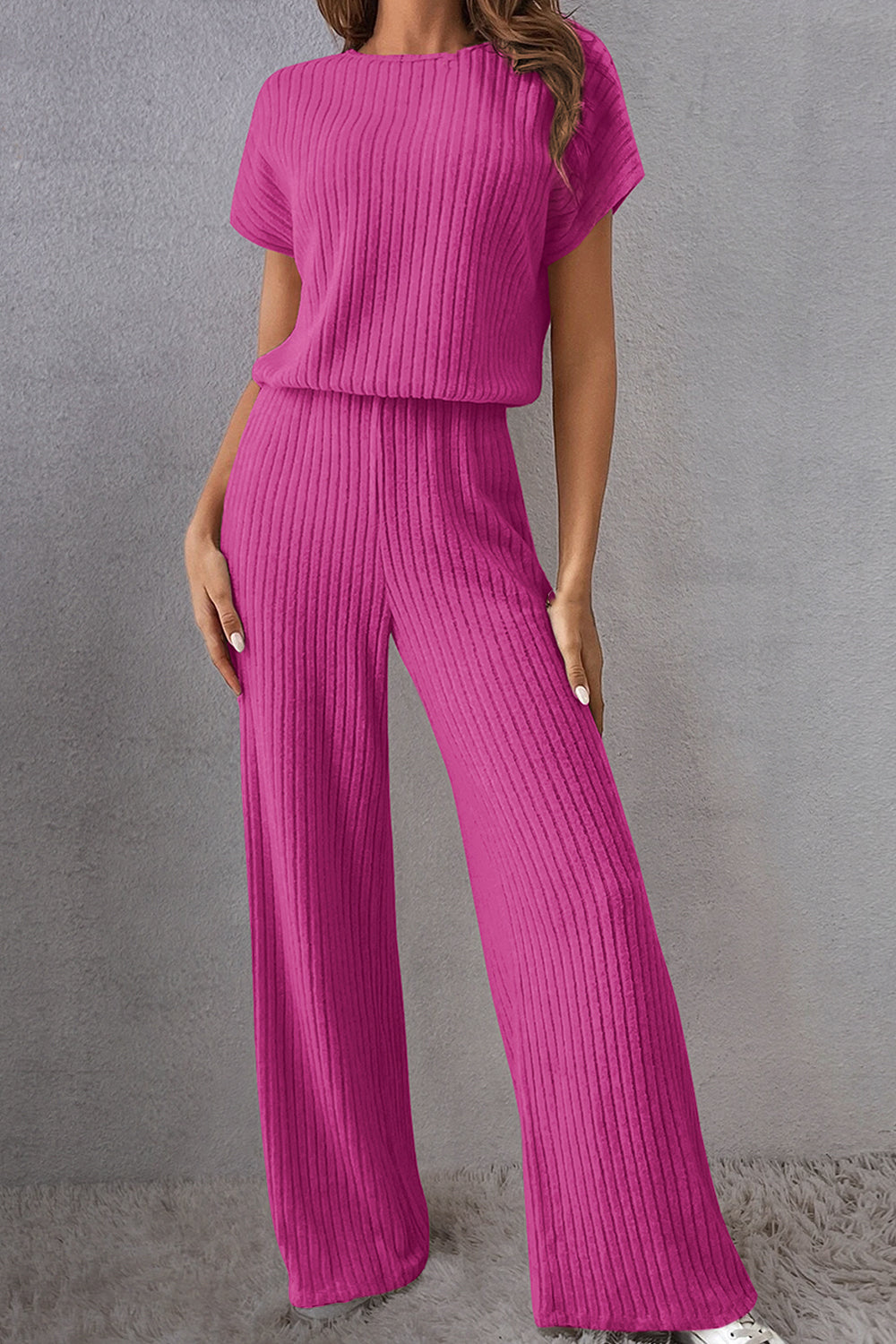 A stylish Round Neck Short Sleeve Jumpsuit displayed on a mannequin, showcasing its chic design and comfortable fit.