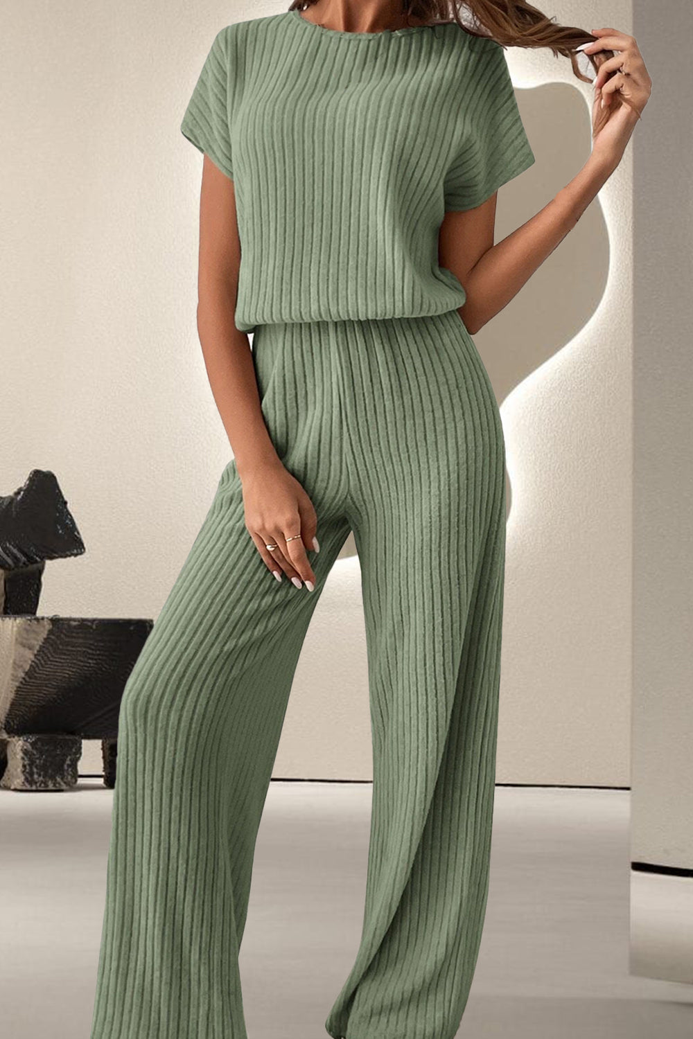 A stylish Round Neck Short Sleeve Jumpsuit displayed on a mannequin, showcasing its chic design and comfortable fit.