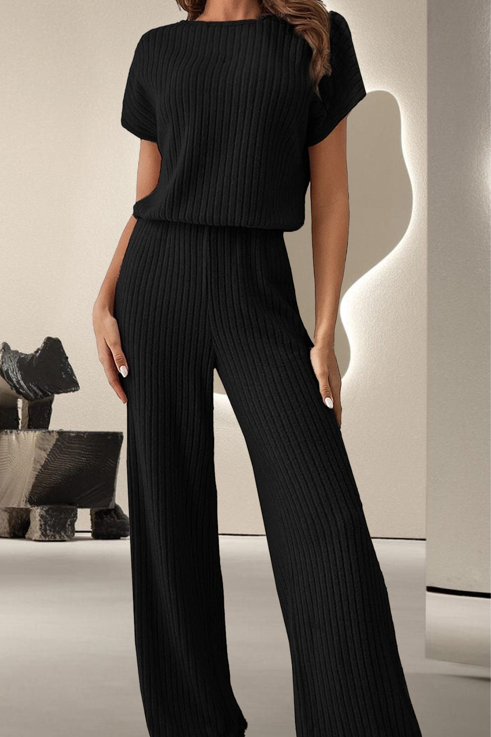 A stylish Round Neck Short Sleeve Jumpsuit displayed on a mannequin, showcasing its chic design and comfortable fit.