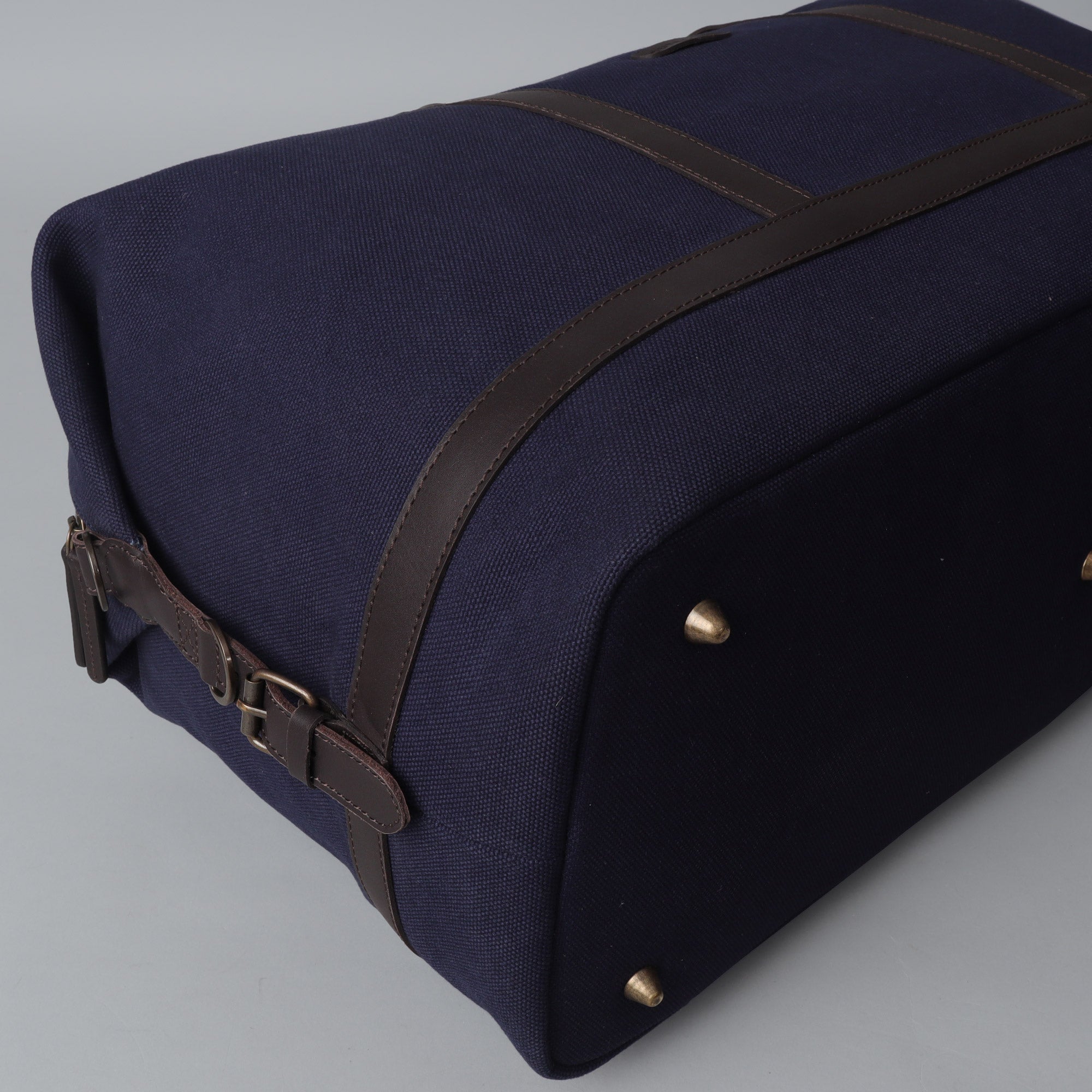 Runway Canvas Travel Bag showcasing its vintage design, adjustable strap, and durable materials, perfect for stylish travel.